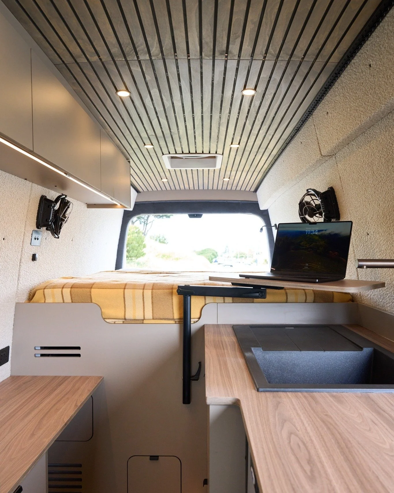 Home office, anywhere. 

Van life doesn't mean sacrificing comfort or productivity. James and Amanda needed a space that could handle full-time remote work and be a relaxing home base.

How we made it happen:

-Adaptable workspace: Multiple table set