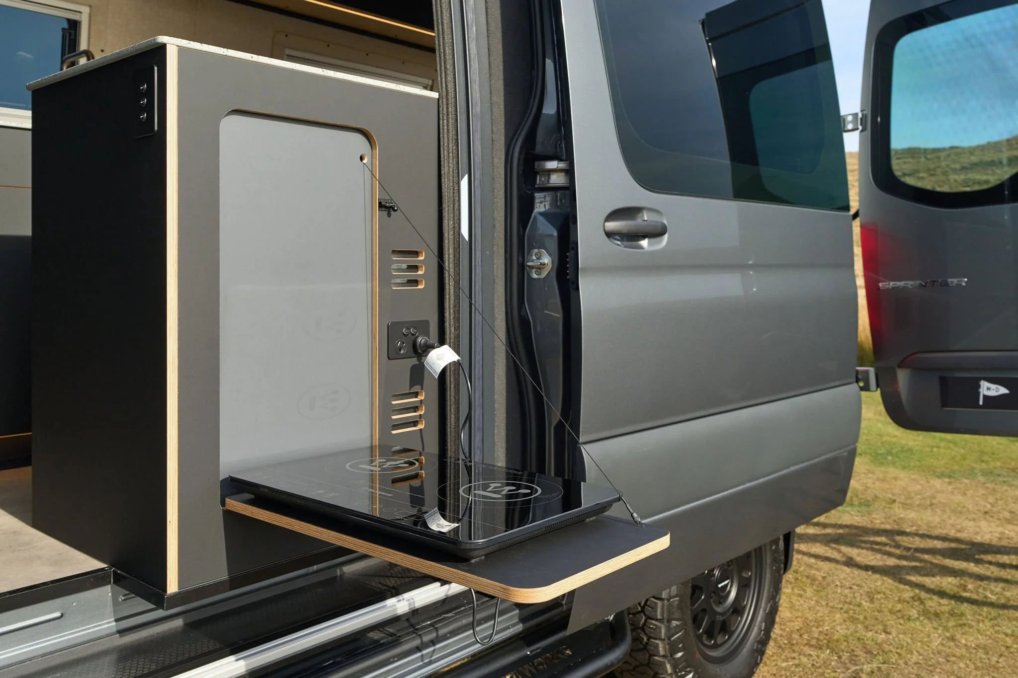 mercedes-4x4-sprinter-matt-and-dans-campervans-cooking-outside.jpg