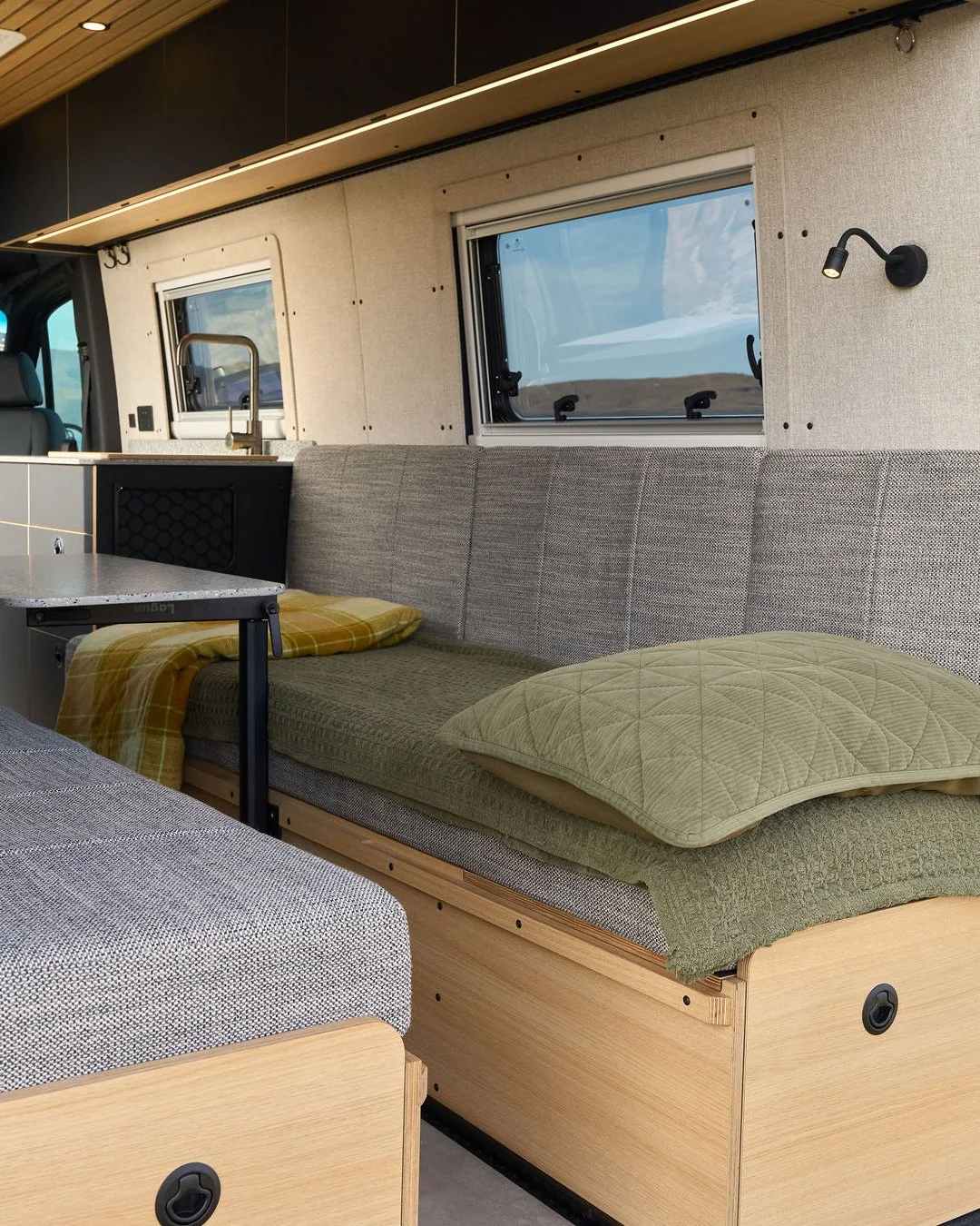 Who says van life means roughing it?

Our latest custom campervan conversion leans towards the finer things in life. On the outside, this van is all rugged business. But step inside, and it transitions into a sleek, premium sanctuary. We paired warm 