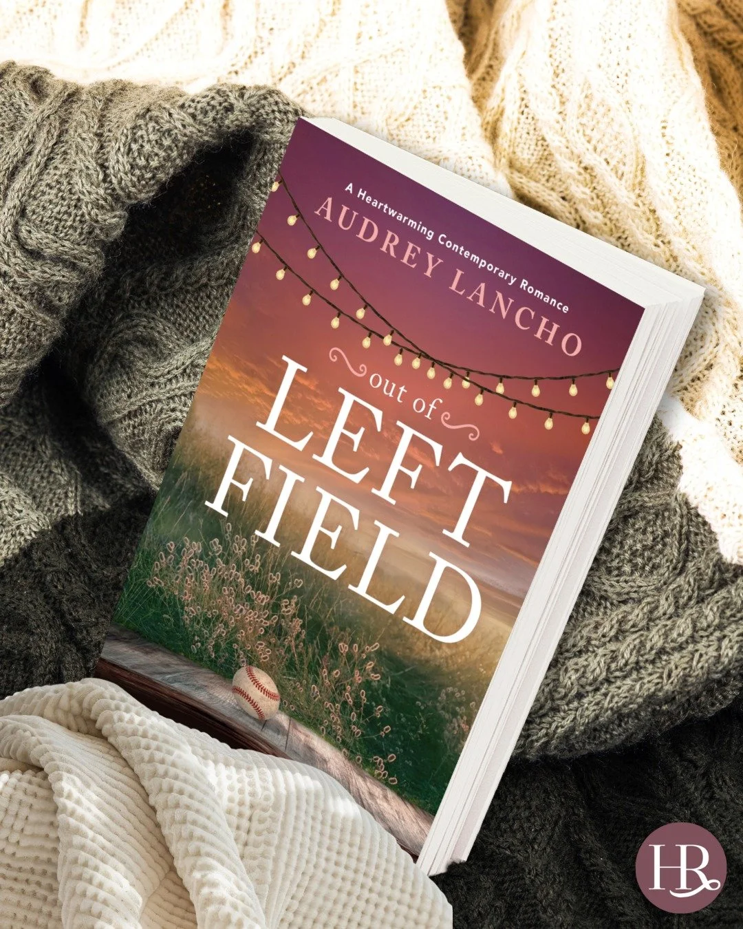Time to get cozy with a sports romance! Out of Left Field by @audreylancho is the perfect autumn book that feels like drinking a warm cup of tea. Grab it today! 🧡

Shop now at the link in bio! 

#sportsromance #smalltownromance #sweetromance #readin