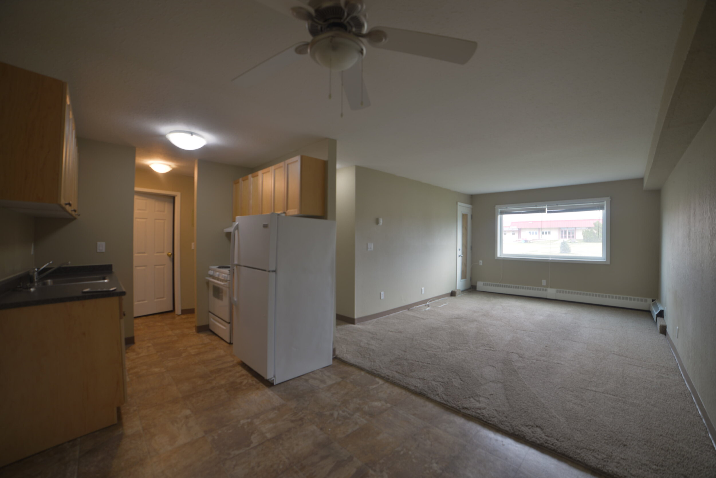 sunridge-apartments-10901-15-st-dawson-creek-kitchen-dining-living-rooms.JPG