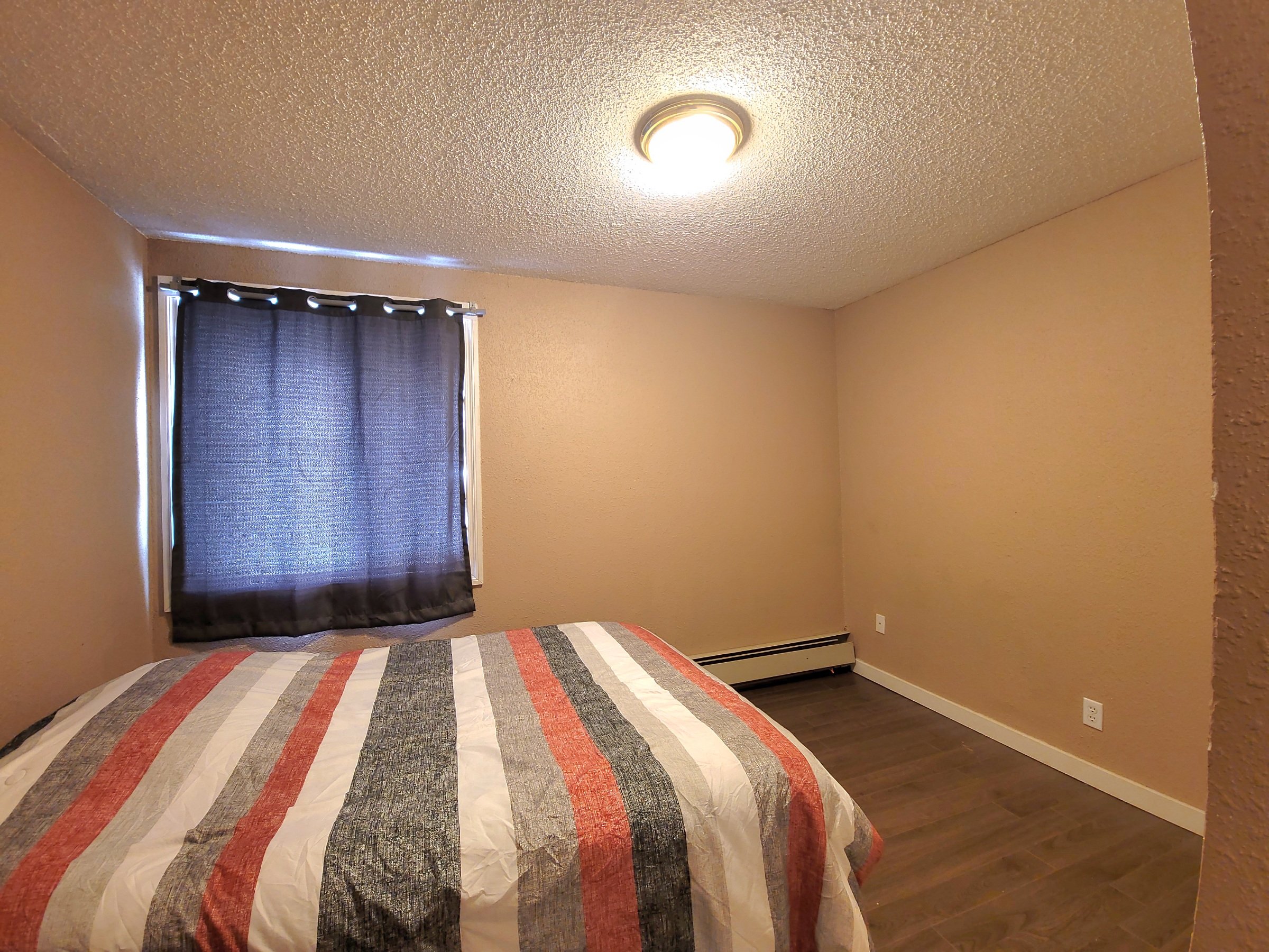 ambassador-apartments-10023-97-ave-fort-st-john-apartment-building-bedroom-2d.jpg