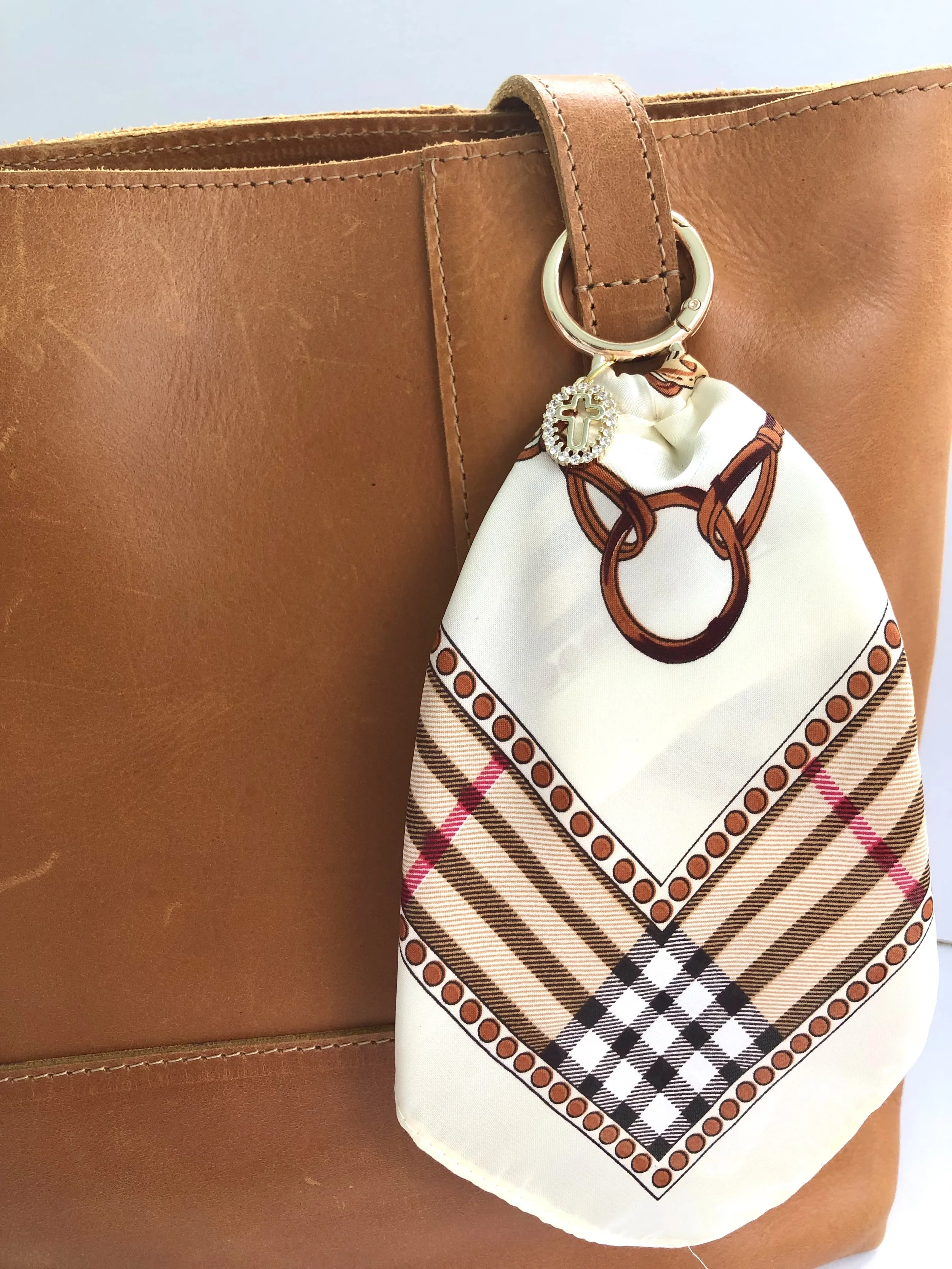 Ivory_Plaid_OvalCrossCharm_OnBag_PH1.jpeg