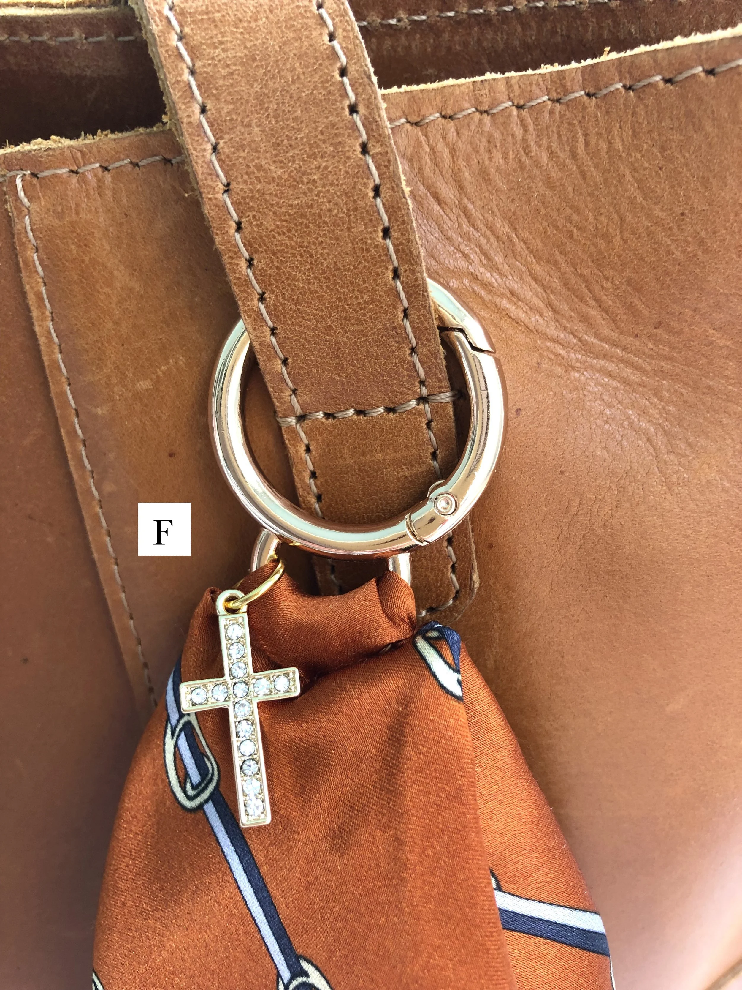 F_Orange_Buckle_RhinestoneCross_OnBag_PH2 copy.jpg