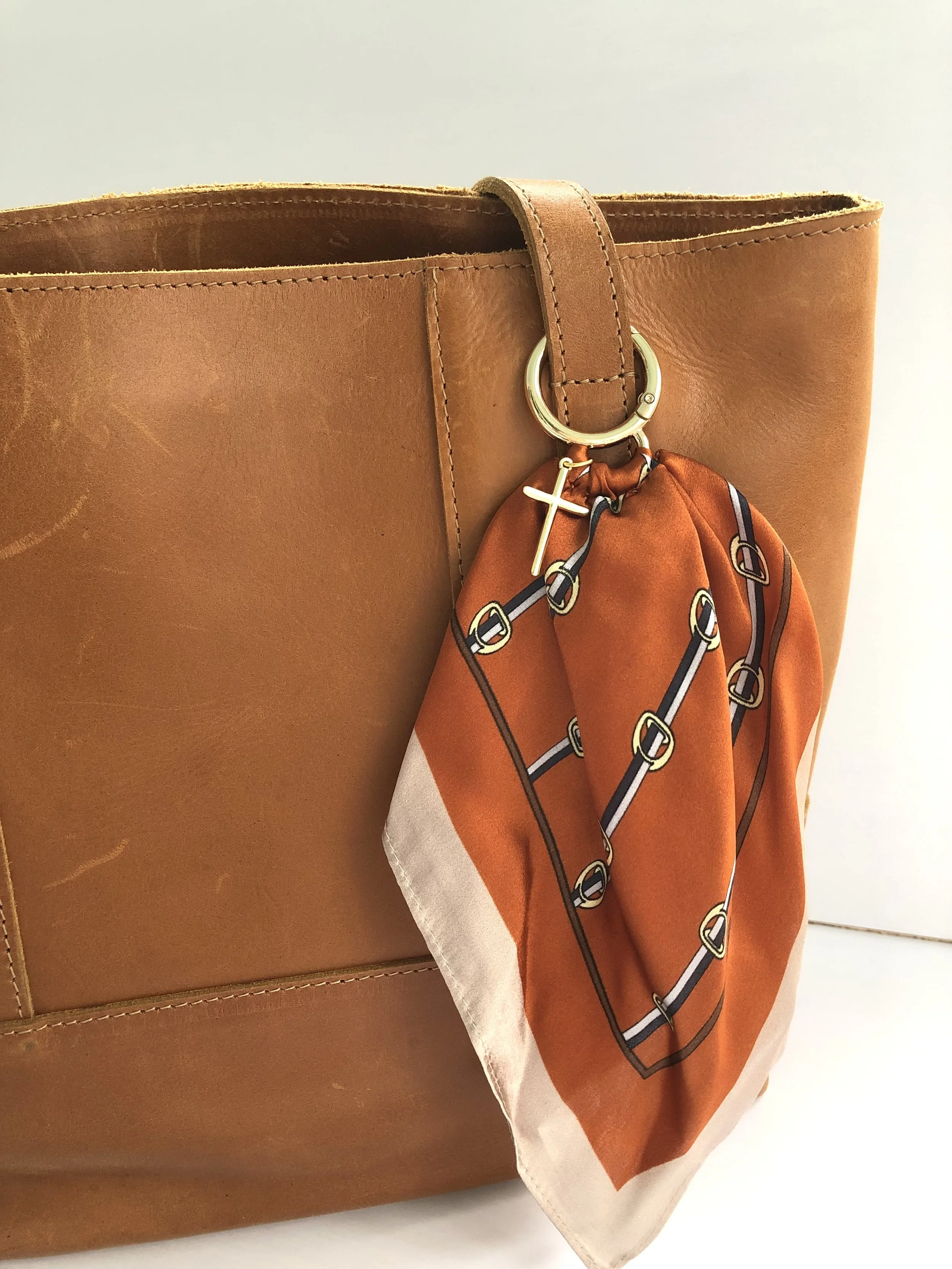Orange_Buckle_SimpleCross_OnBag_PH1.jpeg