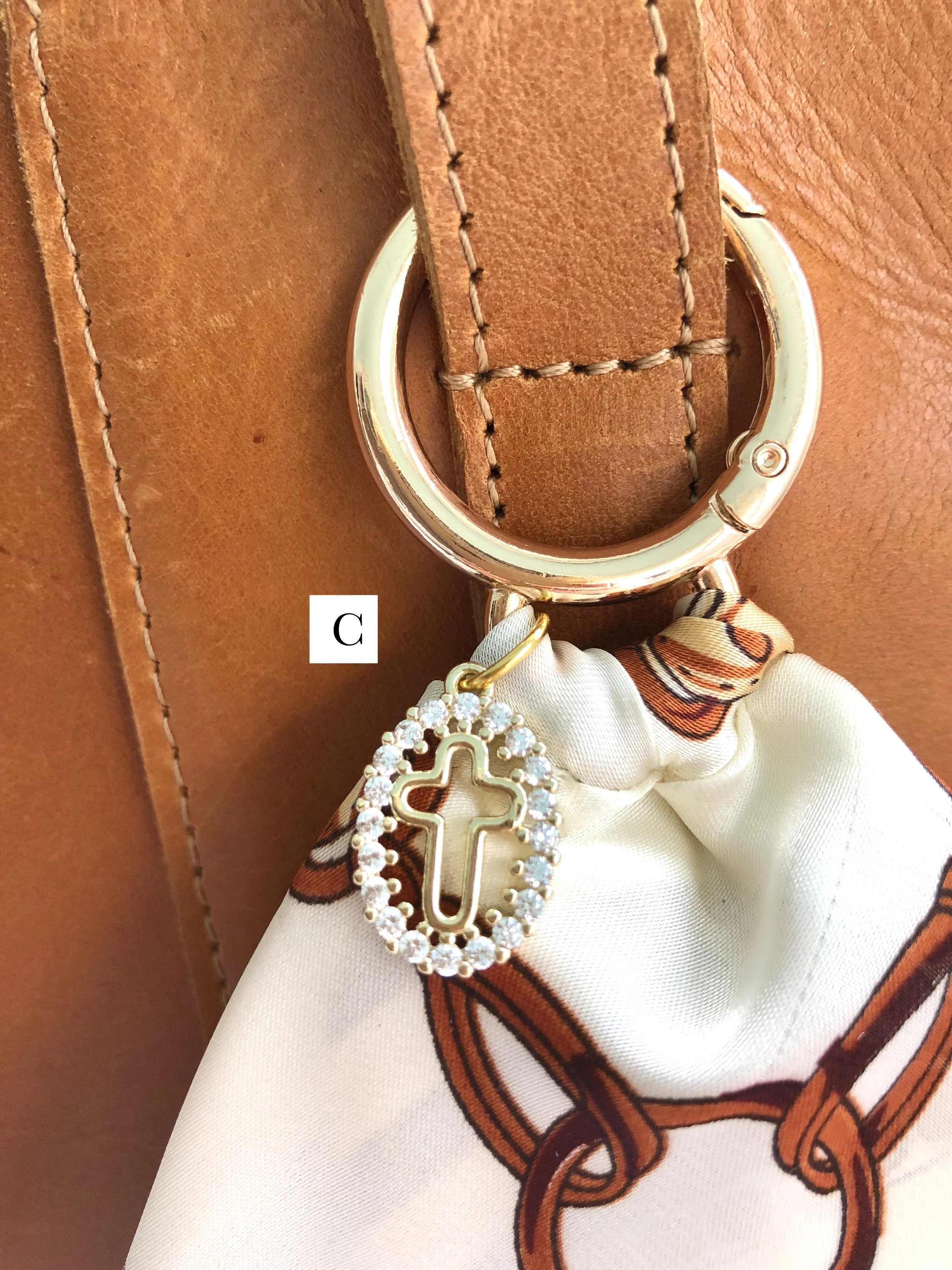 C_Ivory_Plaid_OvalCrossCharm_OnBag_PH2 copy.jpg