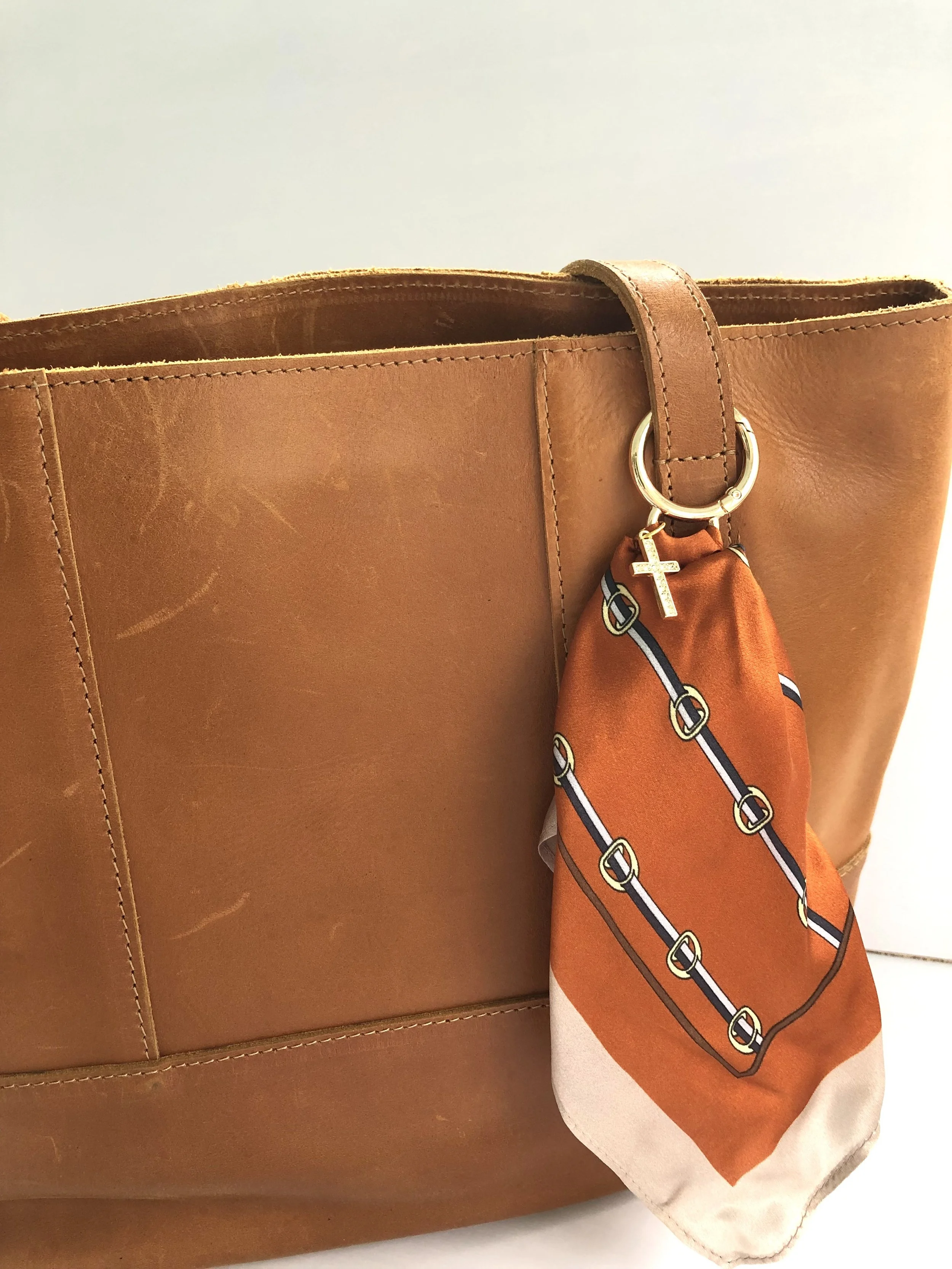 Orange_Buckle_RhinestoneCross_OnBag_PH1.jpeg