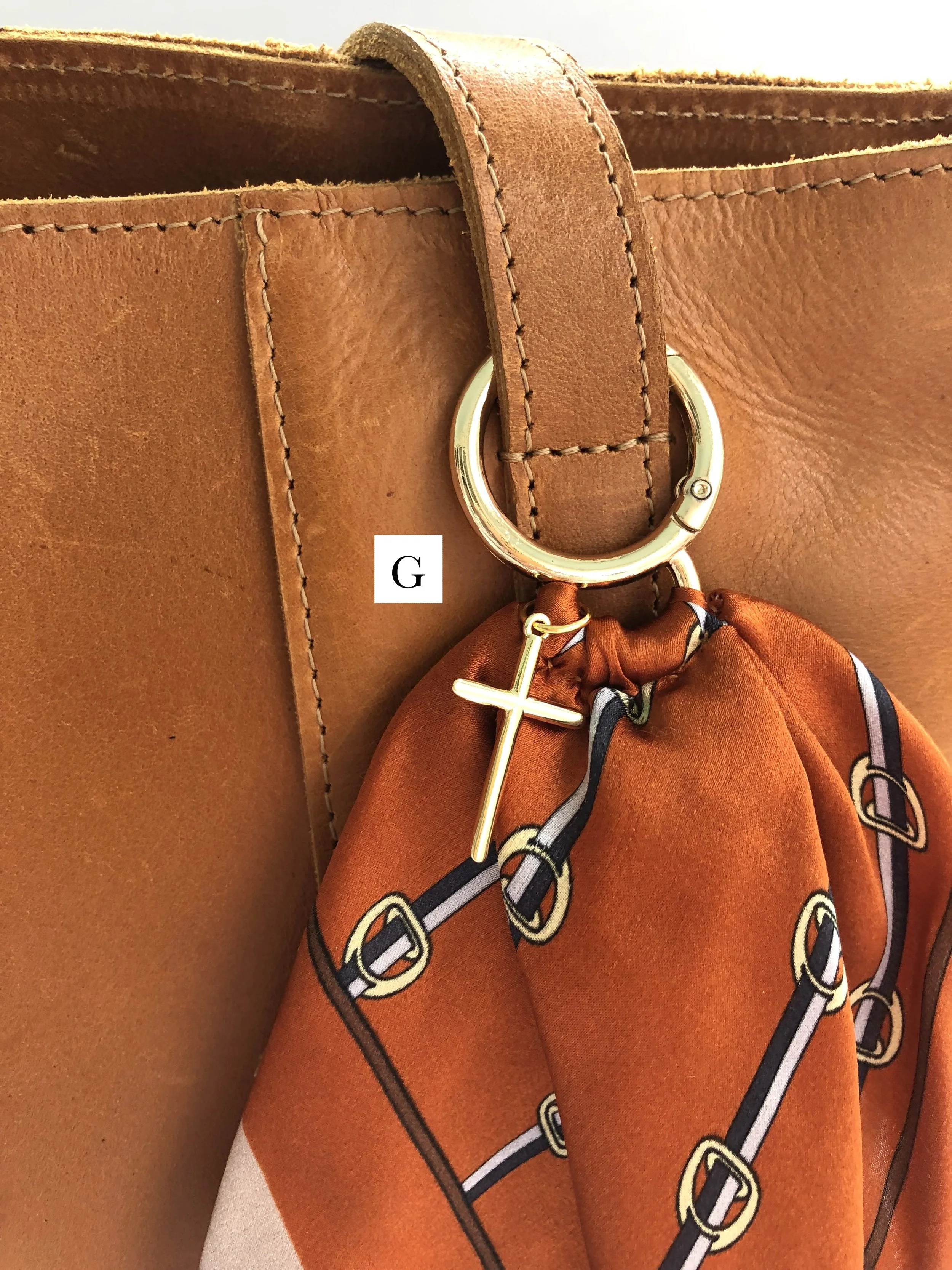 G_Orange_Buckle_SimpleCross_OnBag_PH2 copy.jpg