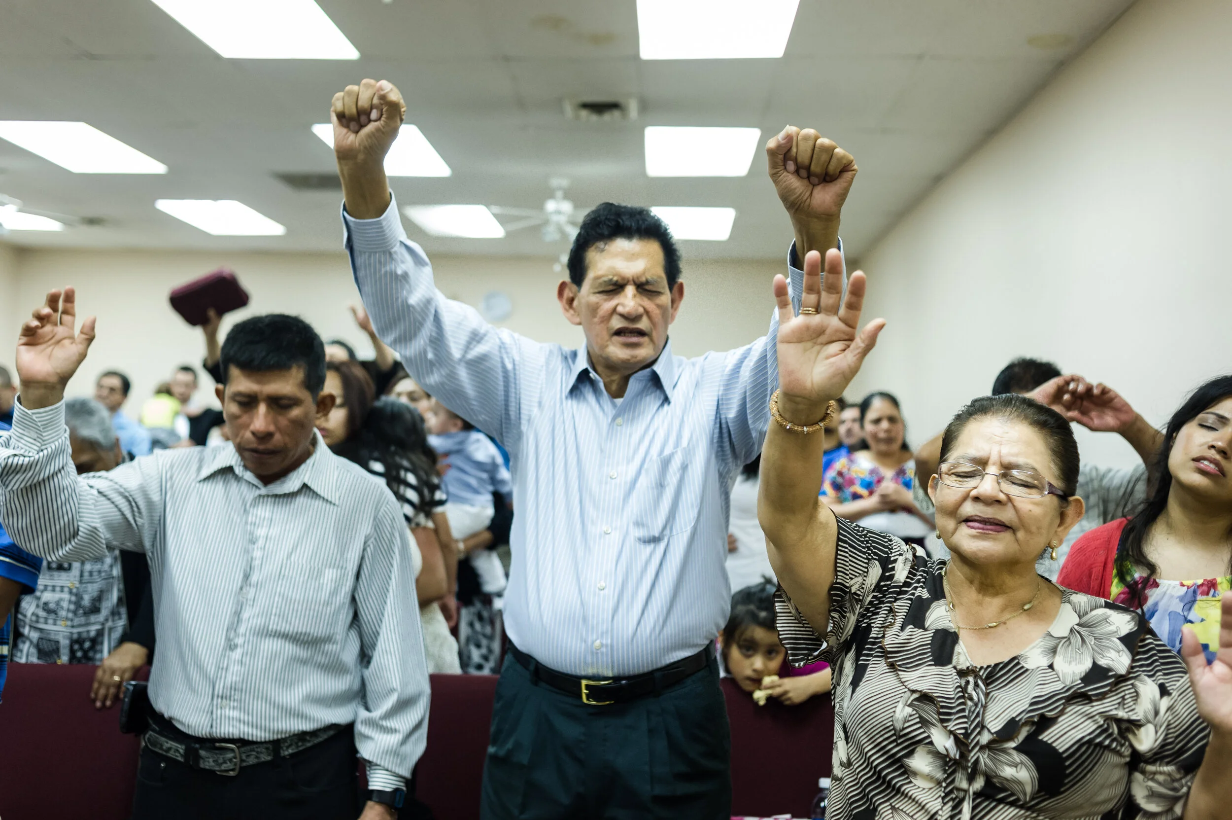  Workers and members of the Latino community commune at the Templo Cristiano la Buena Semilla for prayer, in Leamington, Ontario, on June 2, 2015.    