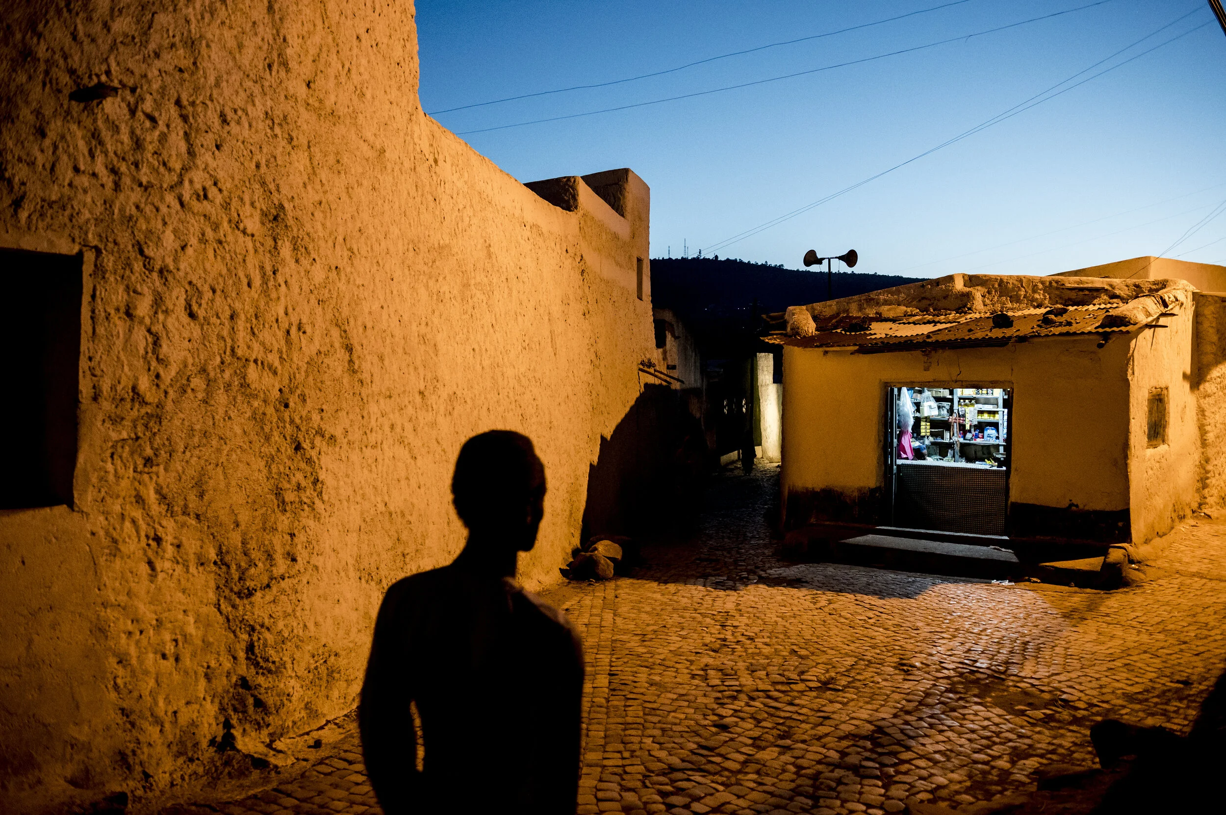  The silhouette of a man walking through the old district of Harar, Ethiopia during the filming of a movie, on Dec, 4, 2018.  