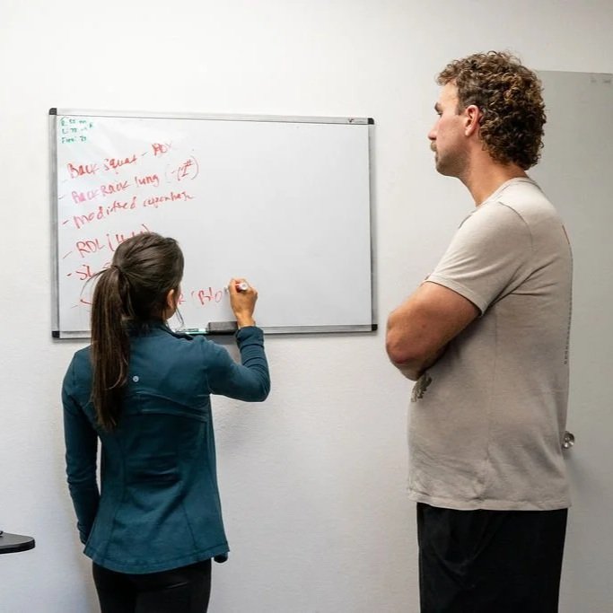 Dr. Susie PT at Athletic Edge PT in San Diego teaching client about ACWR