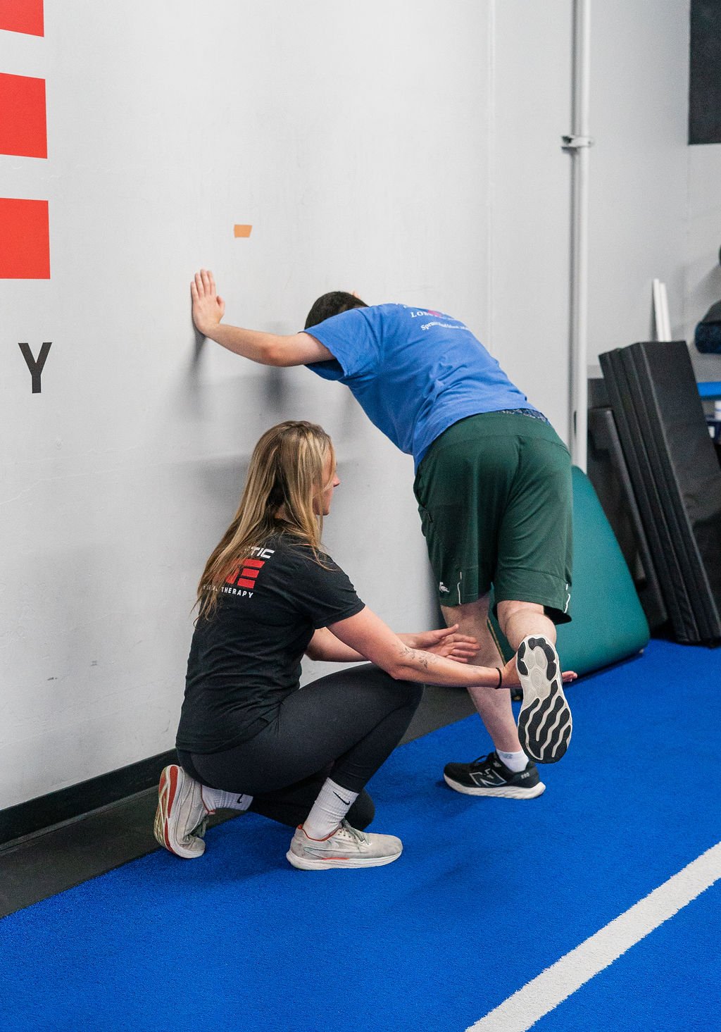 Doctor of Physical Therapy guiding mobility and strength exercises in San Diego