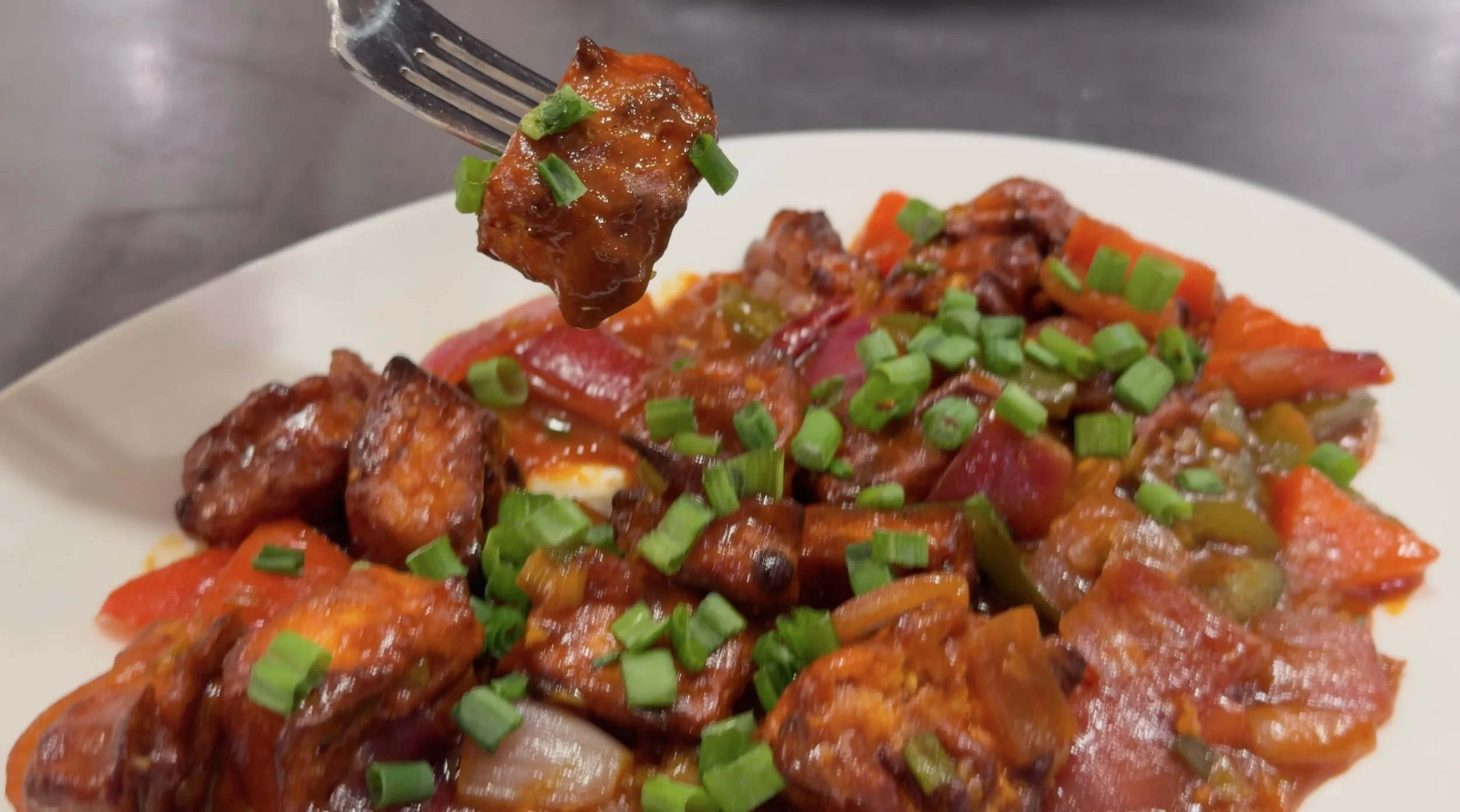 bite of air fryer chilli paneer picture