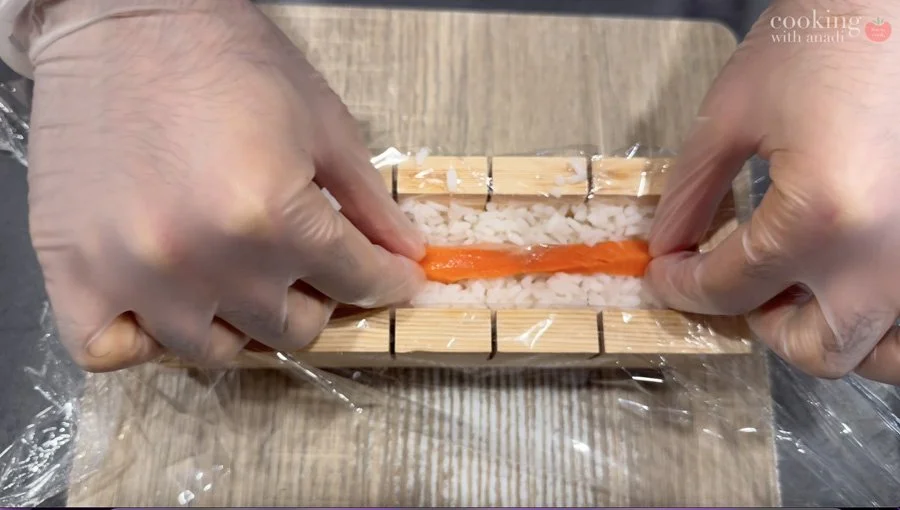 adding long strips of salmon