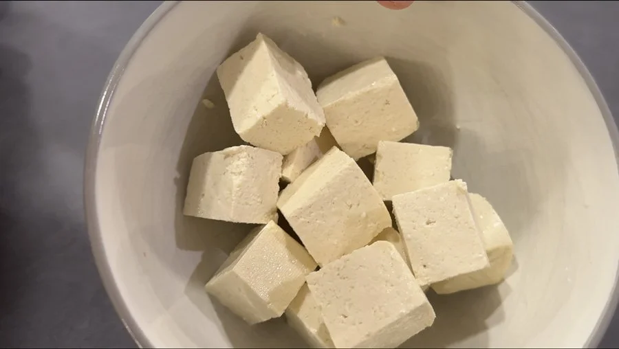 bowl of wet tofu cubes