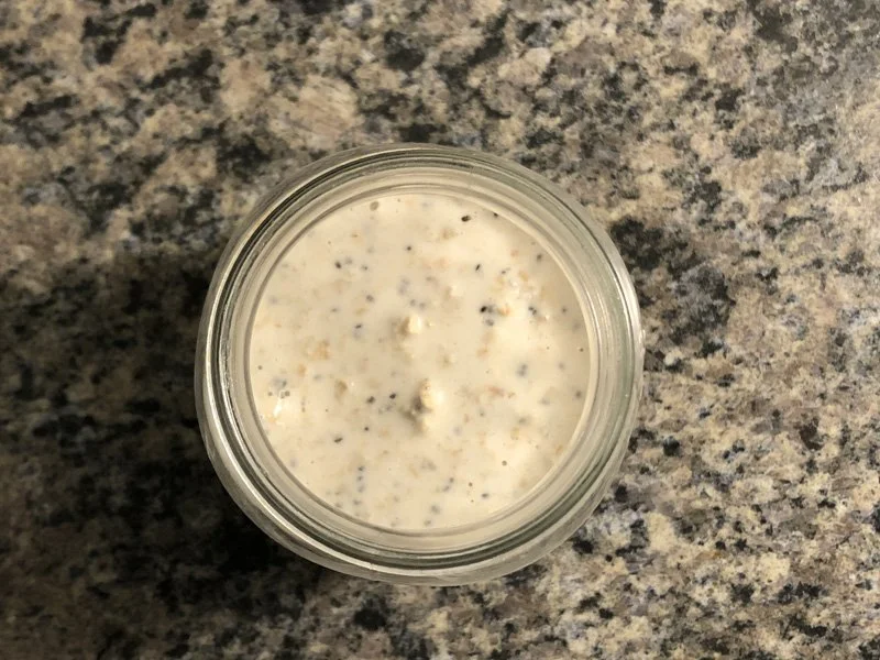 transferring overnight oat mixture to a mason jar