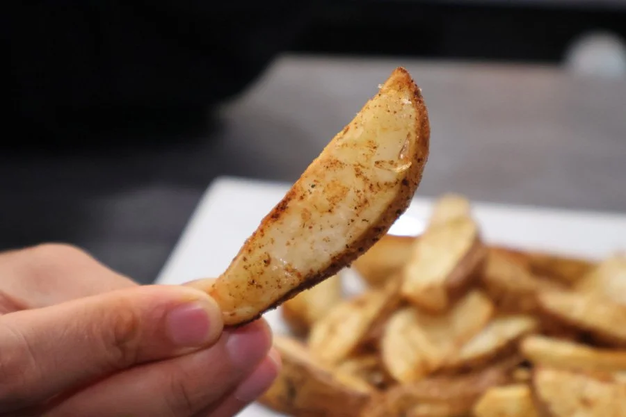 holding air fryer cajun potato wedges
