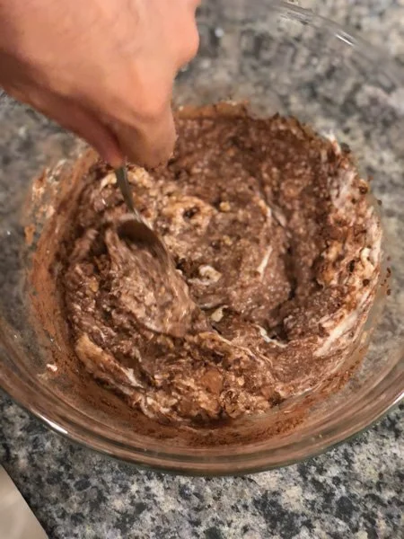 mixing together ingredients for chocolate espresso cheesecake overnight oats
