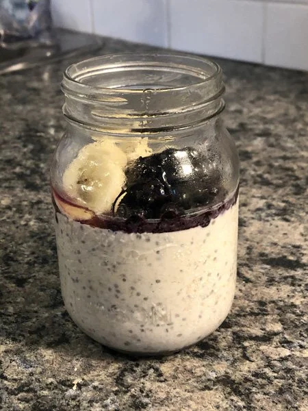 side view of a jar of blueberry cheesecake overnight oats