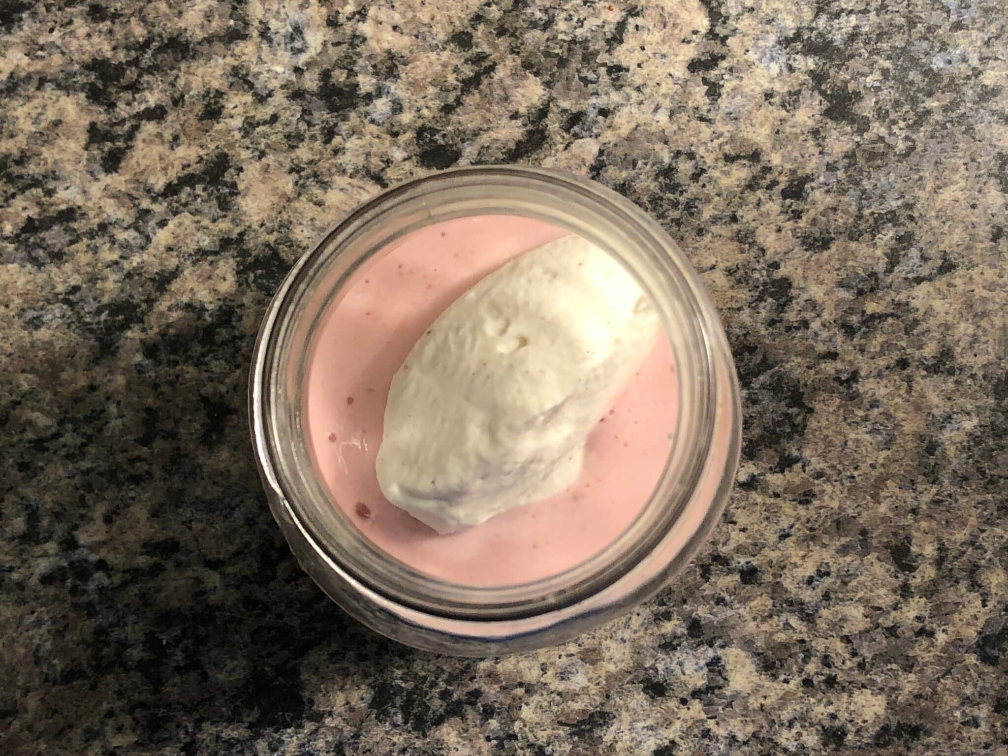 adding whipped cream on smoothie