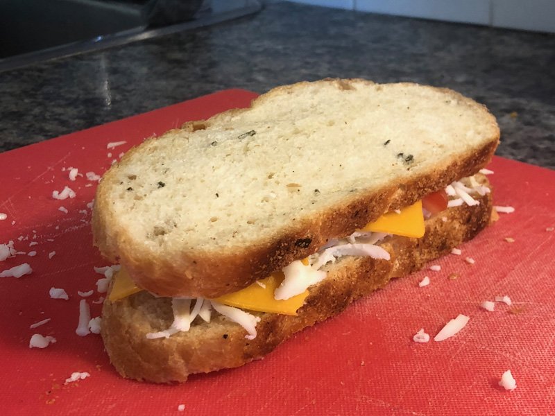adding the second slice of bread on top