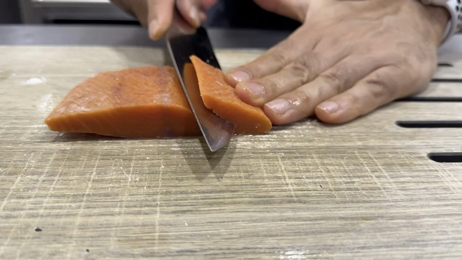 cutting salmon for osaka style pressed sushi