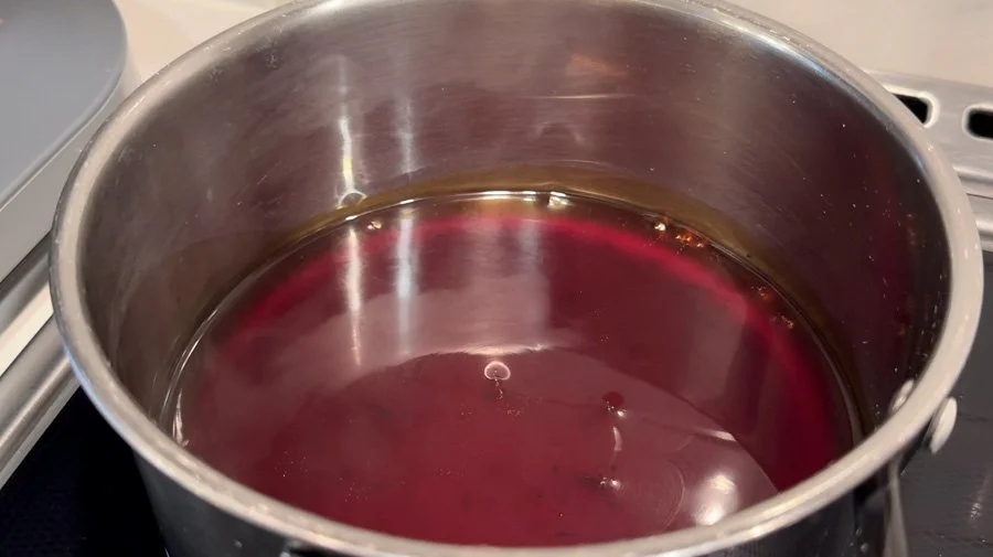 teriyaki sauce reducing in pot