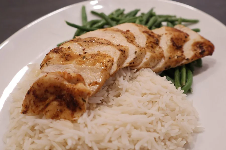 picture of air fryer chicken breast with rice and green beans
