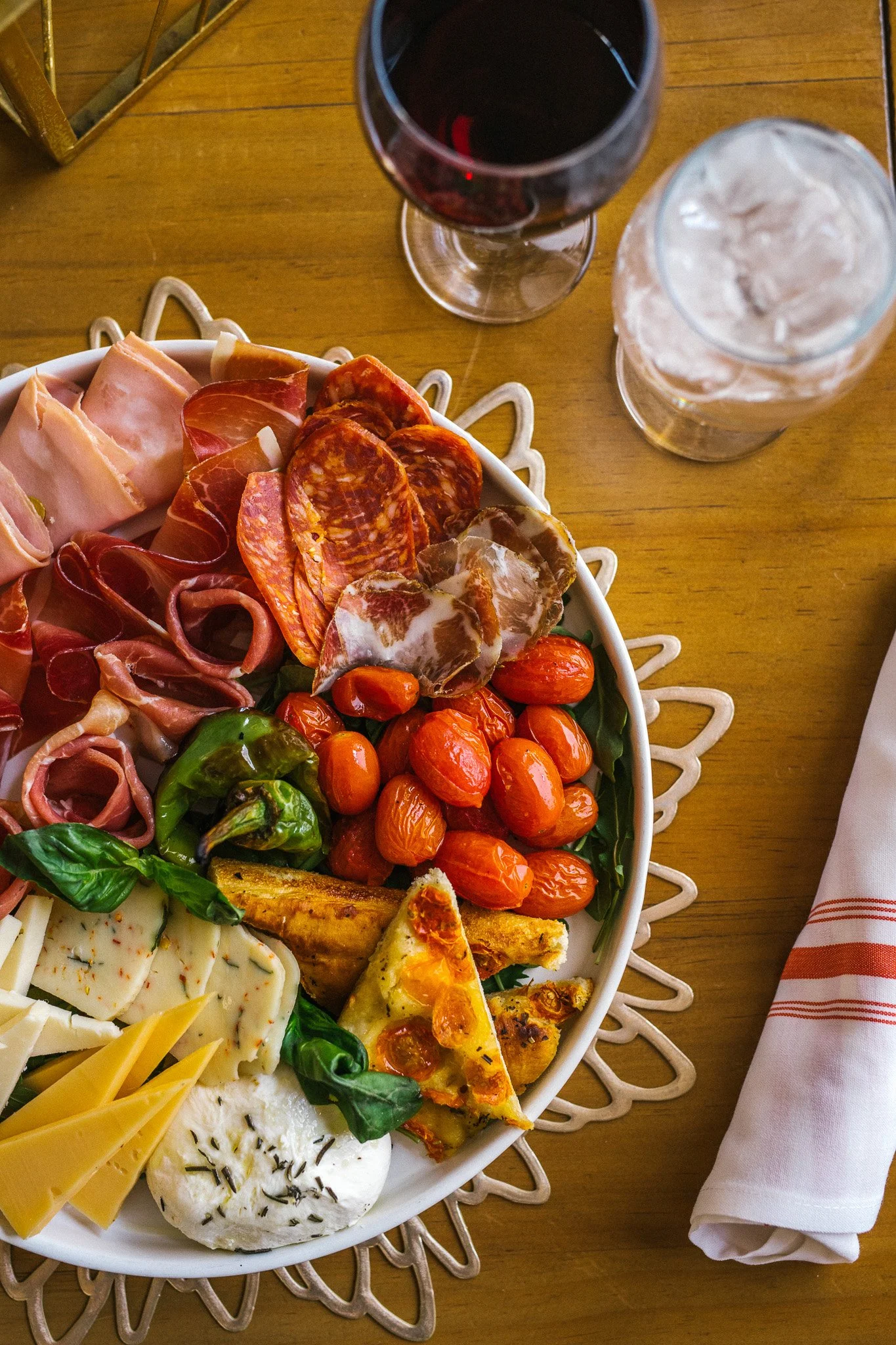 Italian charcuterie board with cured meat, cheese and vegetables