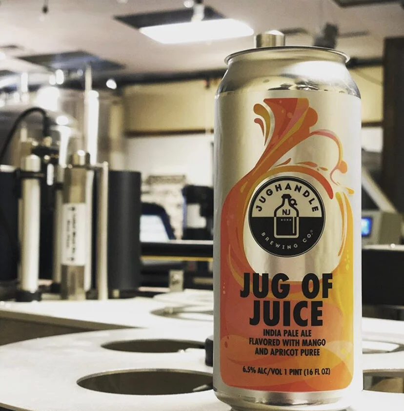 Jug of Juice single can photographed inside the brewery production area