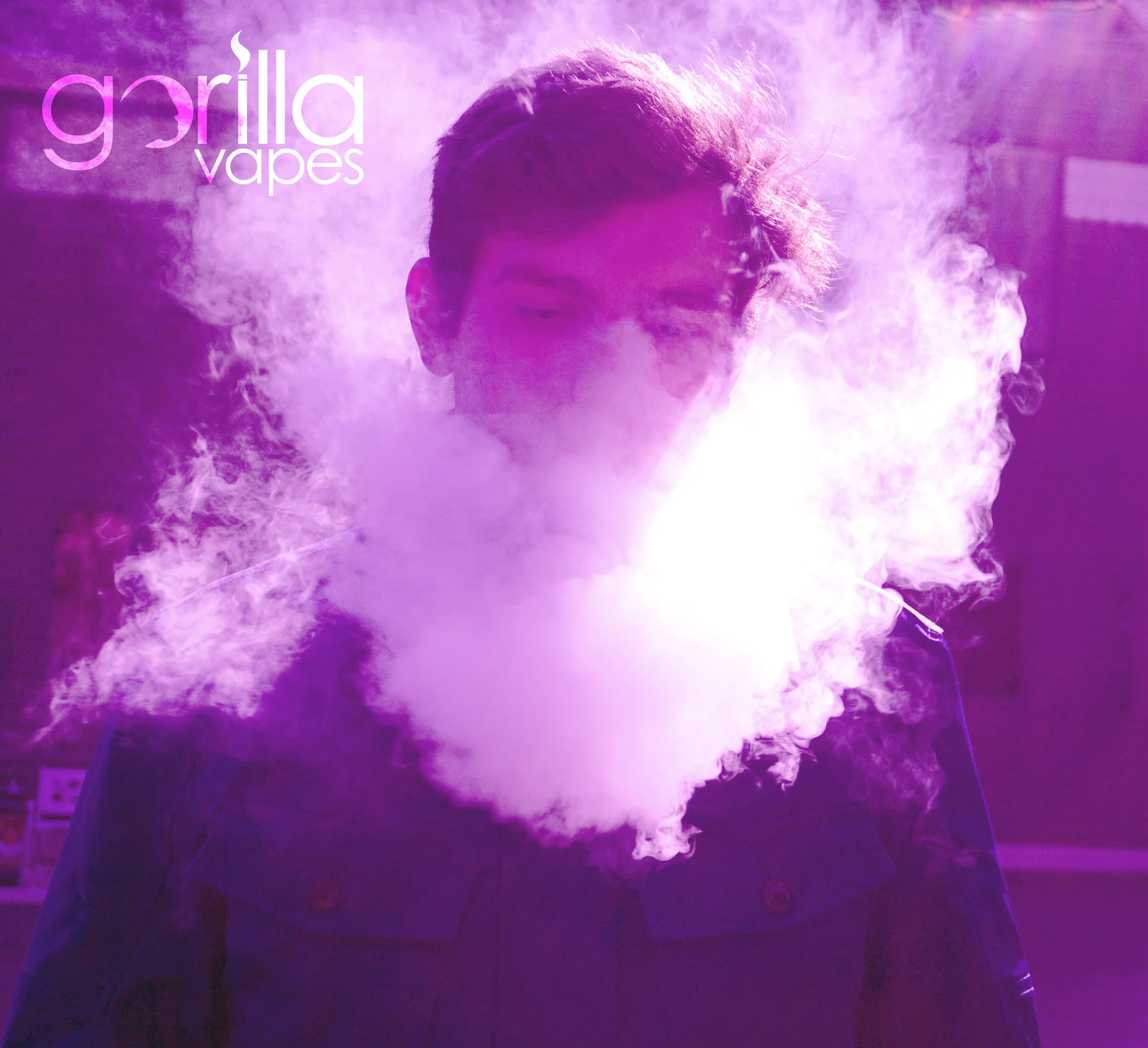 Purple-toned campaign photograph with Gorilla Vapes logo, portrait figure, and atmospheric smoke