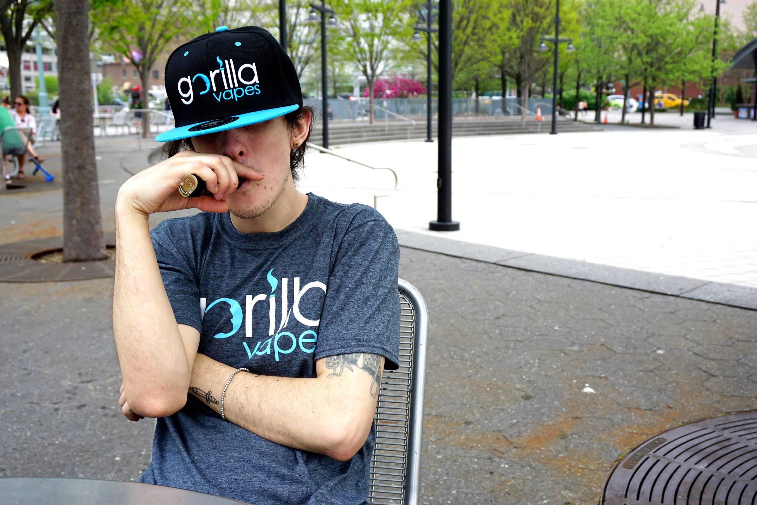 Branded Gorilla Vapes hat and T-shirt worn in an outdoor lifestyle photograph
