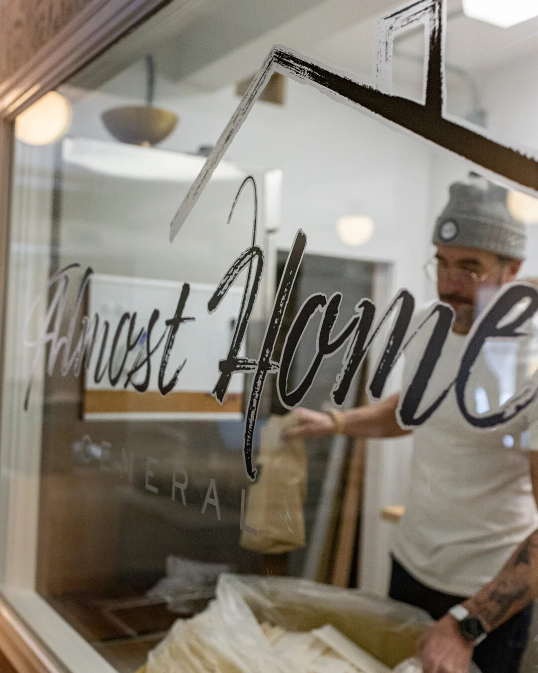 Almost Home General custom wordmark applied to interior glass