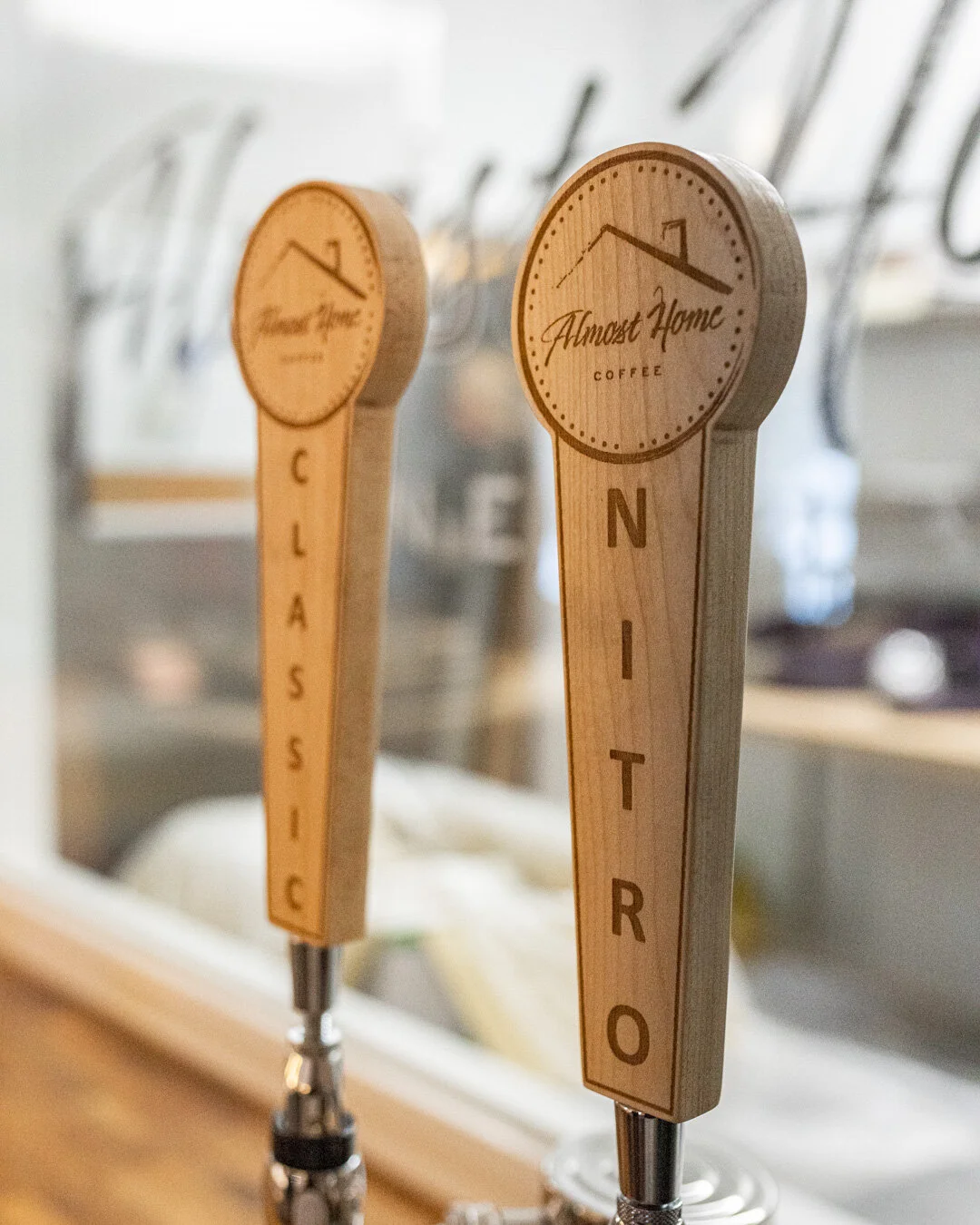 Wooden Almost Home Coffee tap handles with circular brand marks