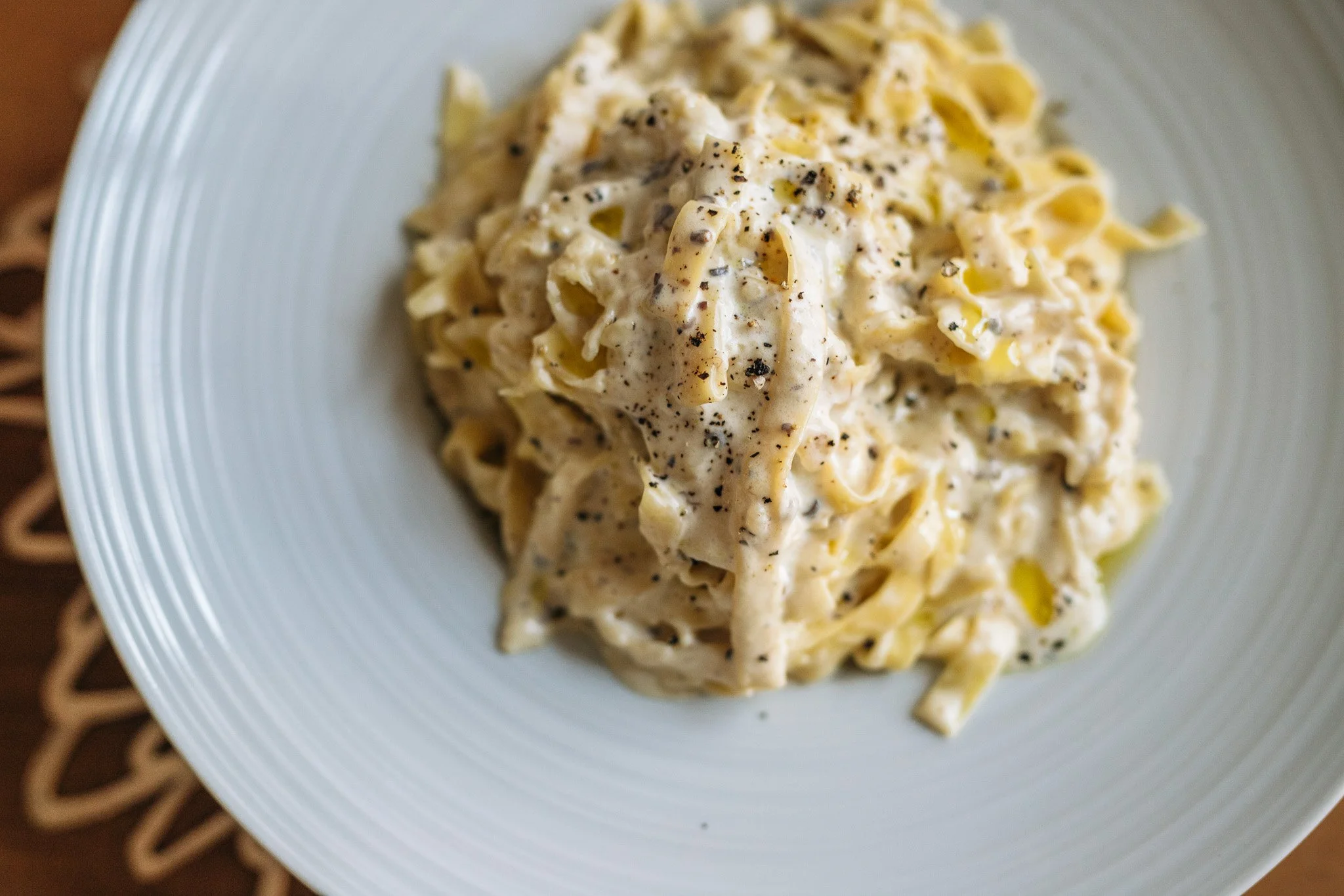 Creamy pasta plated on a white dish