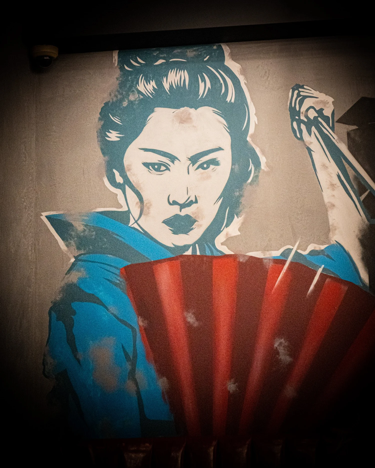 Blue, ivory and red illustrated mural inside the Bad Hat restaurant