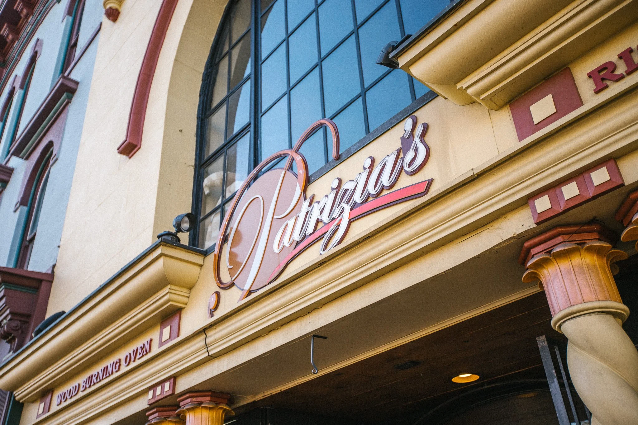 Patrizia’s script sign above the restaurant entrance