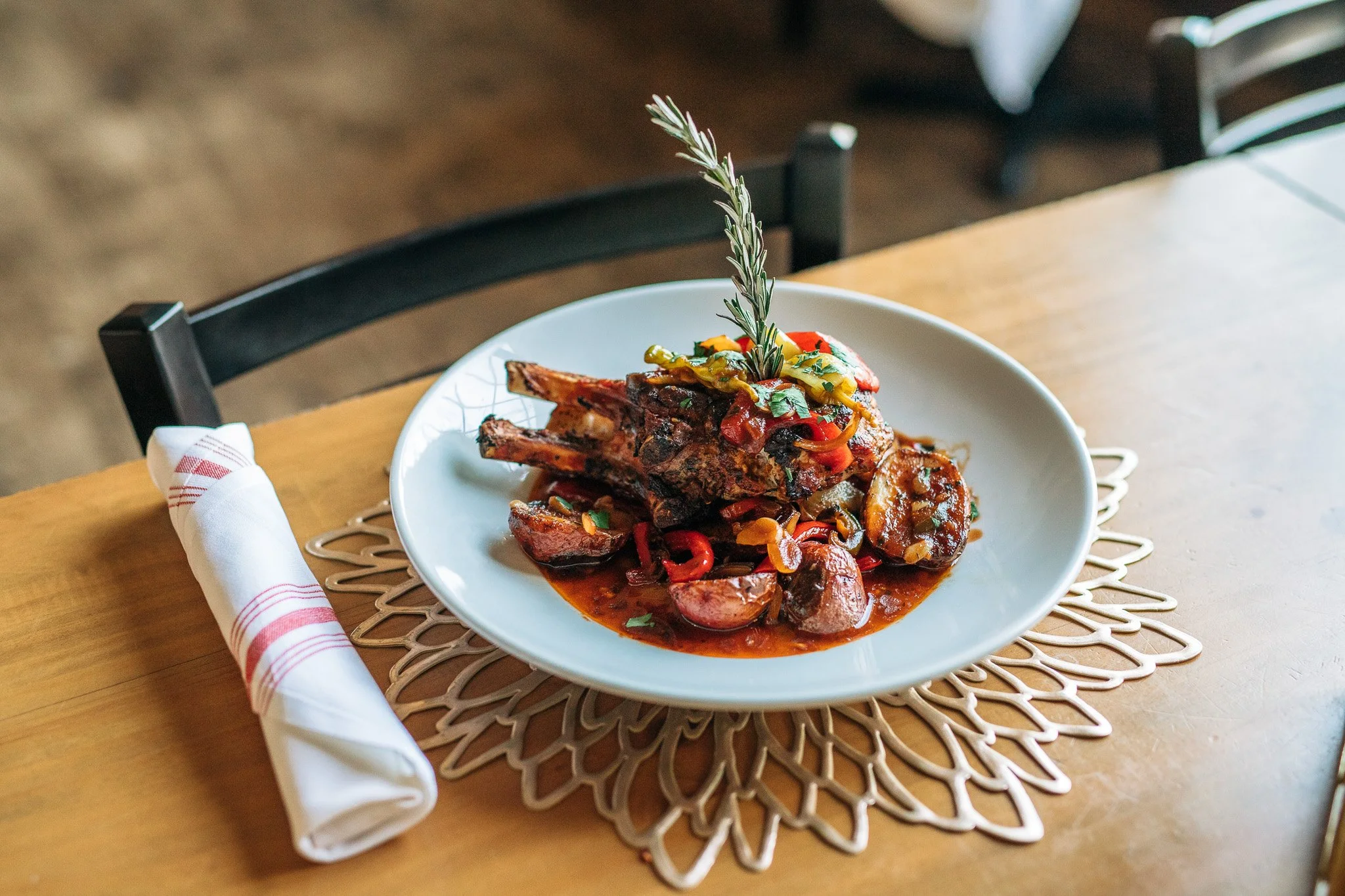 Italian entrée plated at a wooden restaurant table