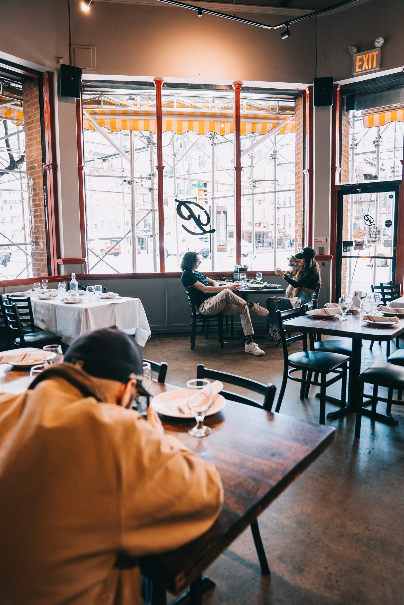 Patrizia’s dining room with sunlight through tall windows
