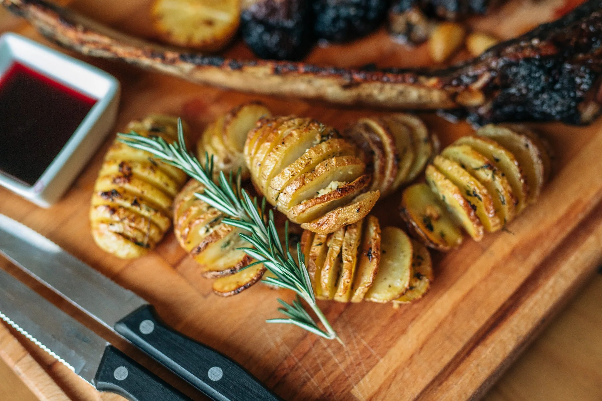 Rosemary roasted potatoes on a wooden serving board