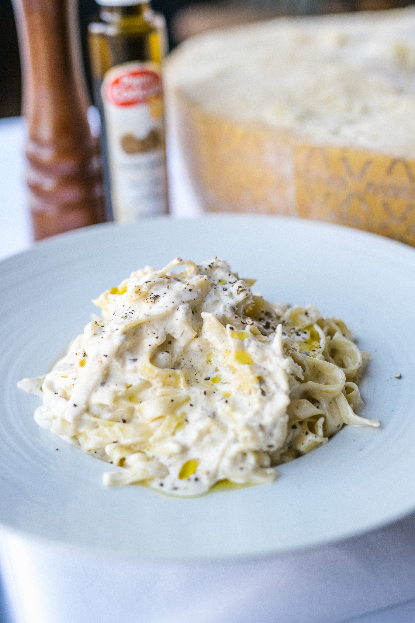Patrizia's pasta dish — creamy fettuccine on a white plate