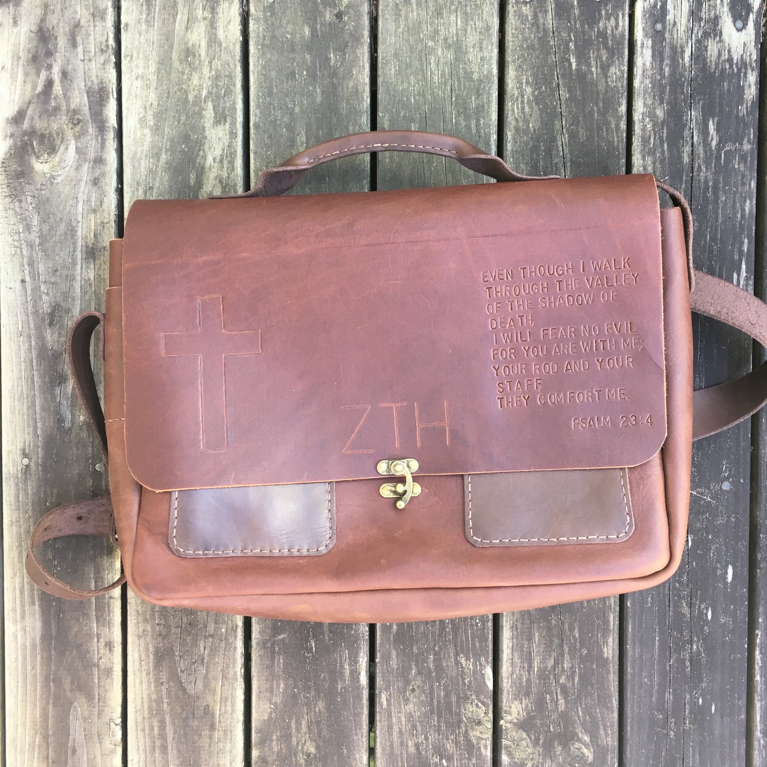 A custom messenger bag with some stamping