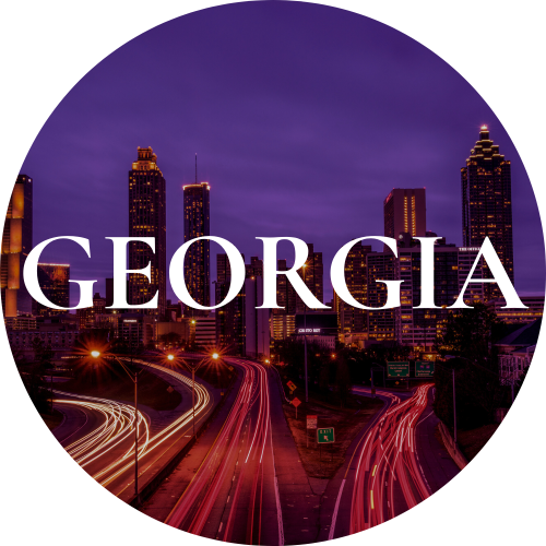 Nighttime city skyline of Atlanta, Georgia with illuminated skyscrapers and light trails on highways, with the word "GEORGIA" in large white text.