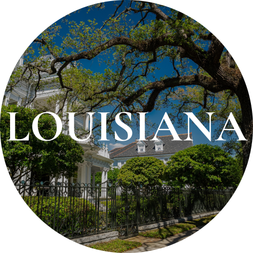 A large tree with sprawling branches over a fenced historic house with white columns and a gray roof, under a clear blue sky, with the word "Louisiana" in large white text.