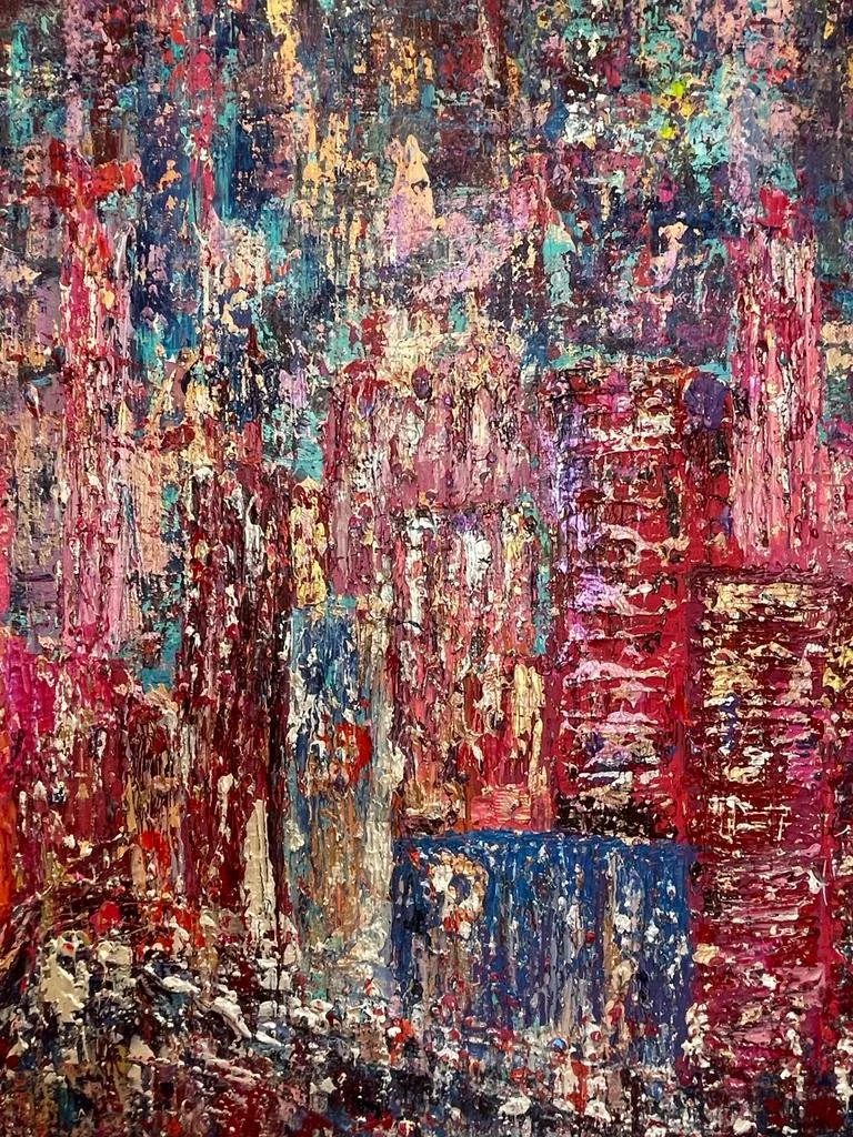 Abstract painting with vibrant strokes of red, pink, blue, purple, and beige colors depicting a cityscape with tall buildings and busy streets.