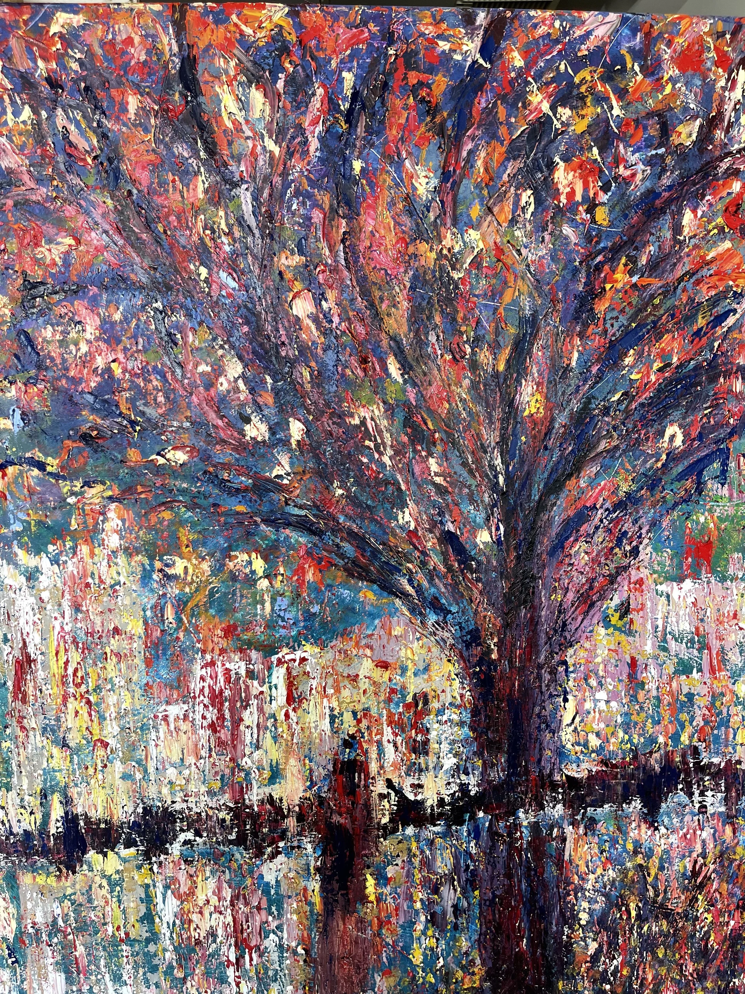 Abstract impressionist painting of a tree with colorful leaves reflecting on a body of water.