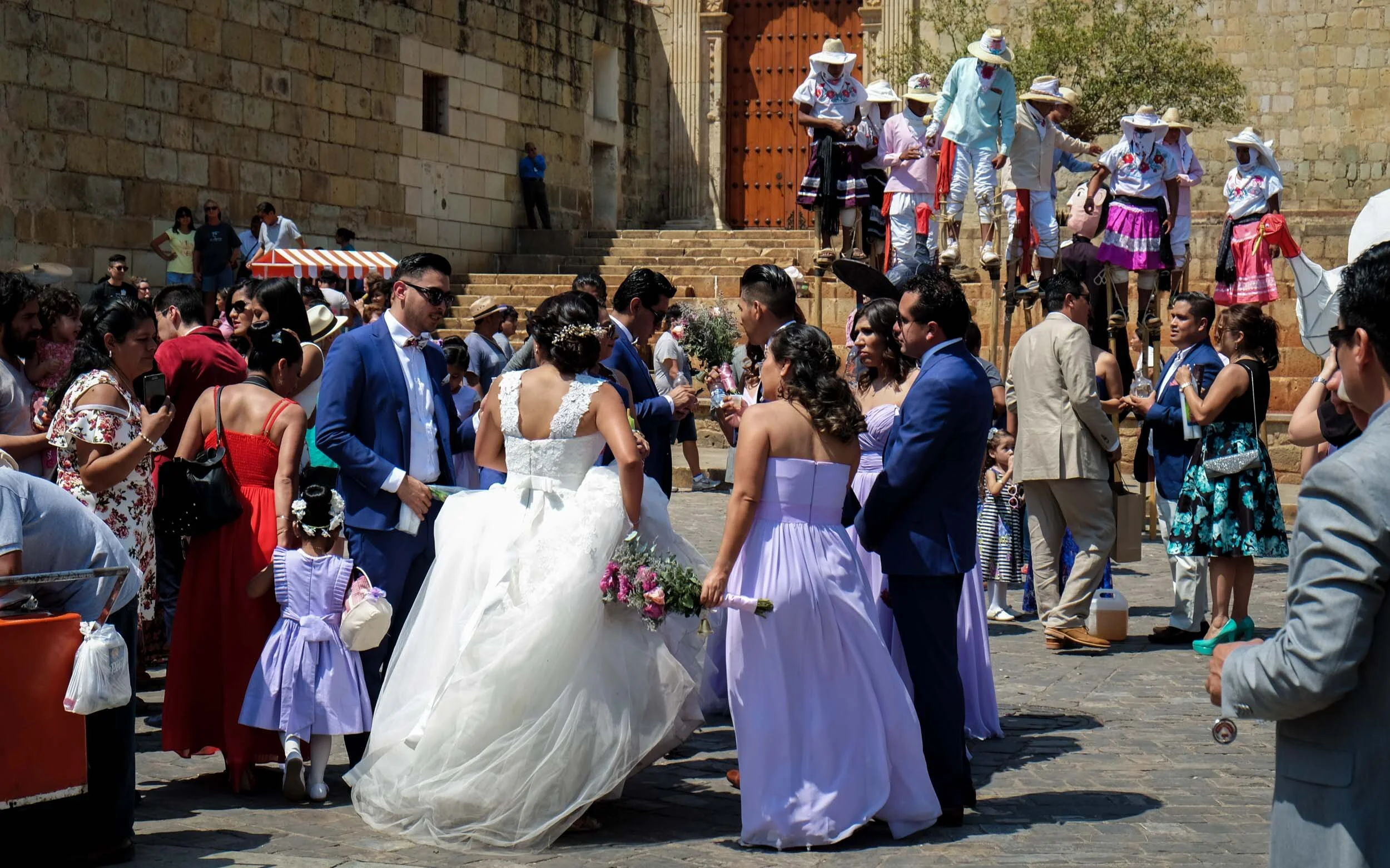 61. Bride and Men on Stilts at the Templo de Santo Domingo (Wedding #1, Oaxaca City, 2017)