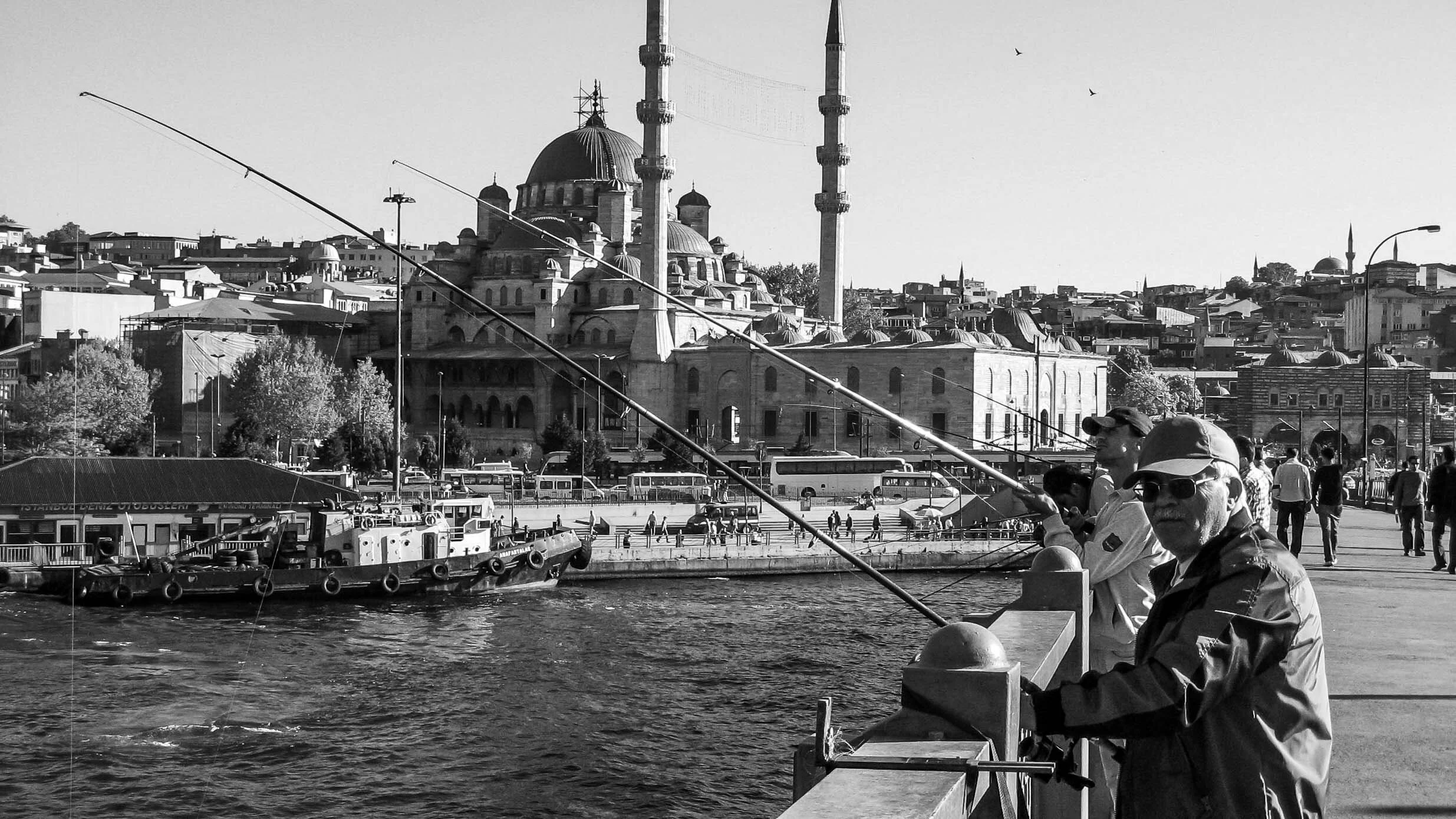 3. Fishing in the Golden Horn estuary off the Galata Bridge, with the New Mosque in the background, built in 1665. (Istanbul, May 10, 2007)
