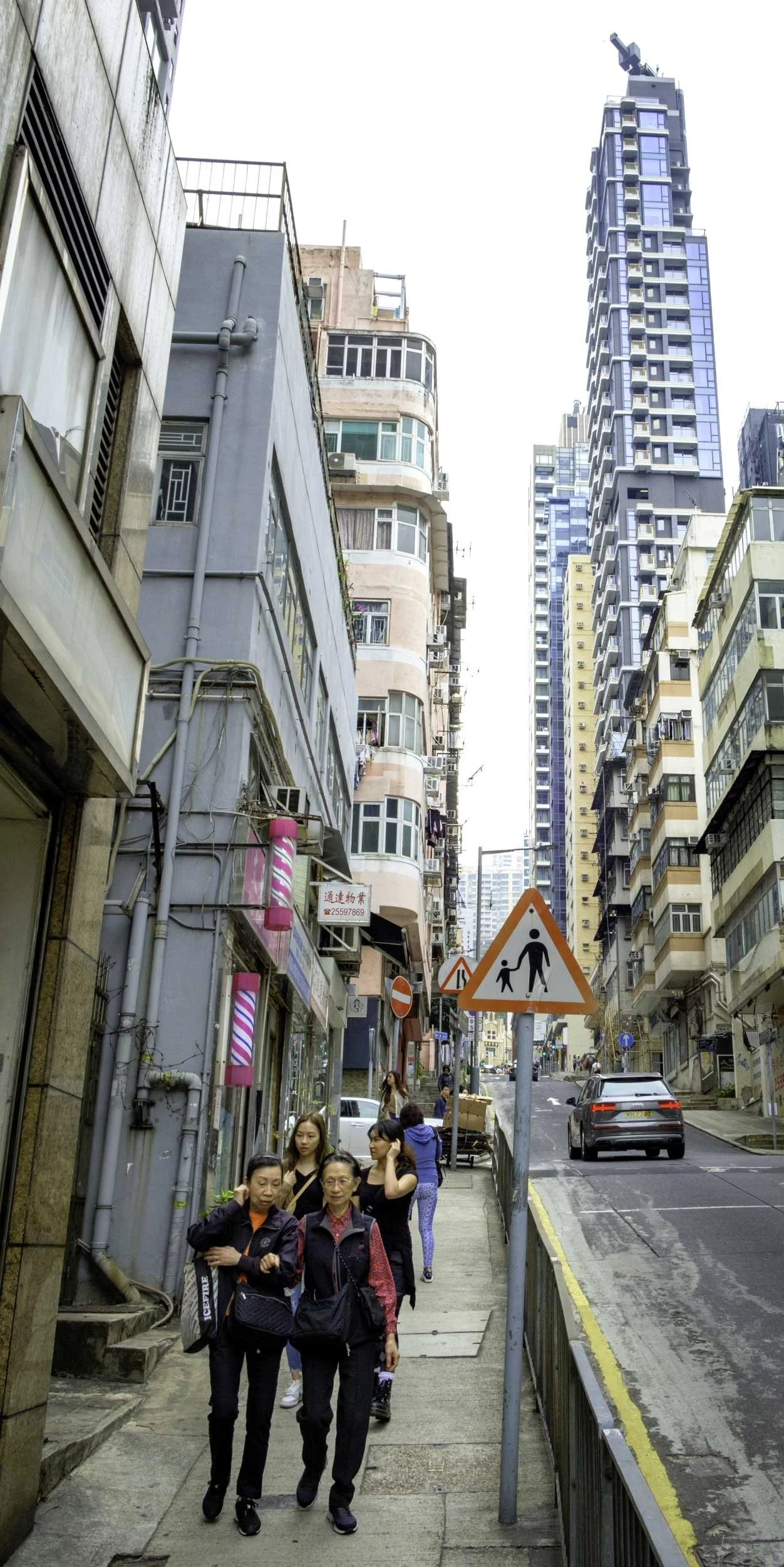 14. Young and old women walking together in the hills of Hong Kong Island (December 30, 2023, , Sai Ying Pun, Hong Kong Island, Hong Kong SAR)