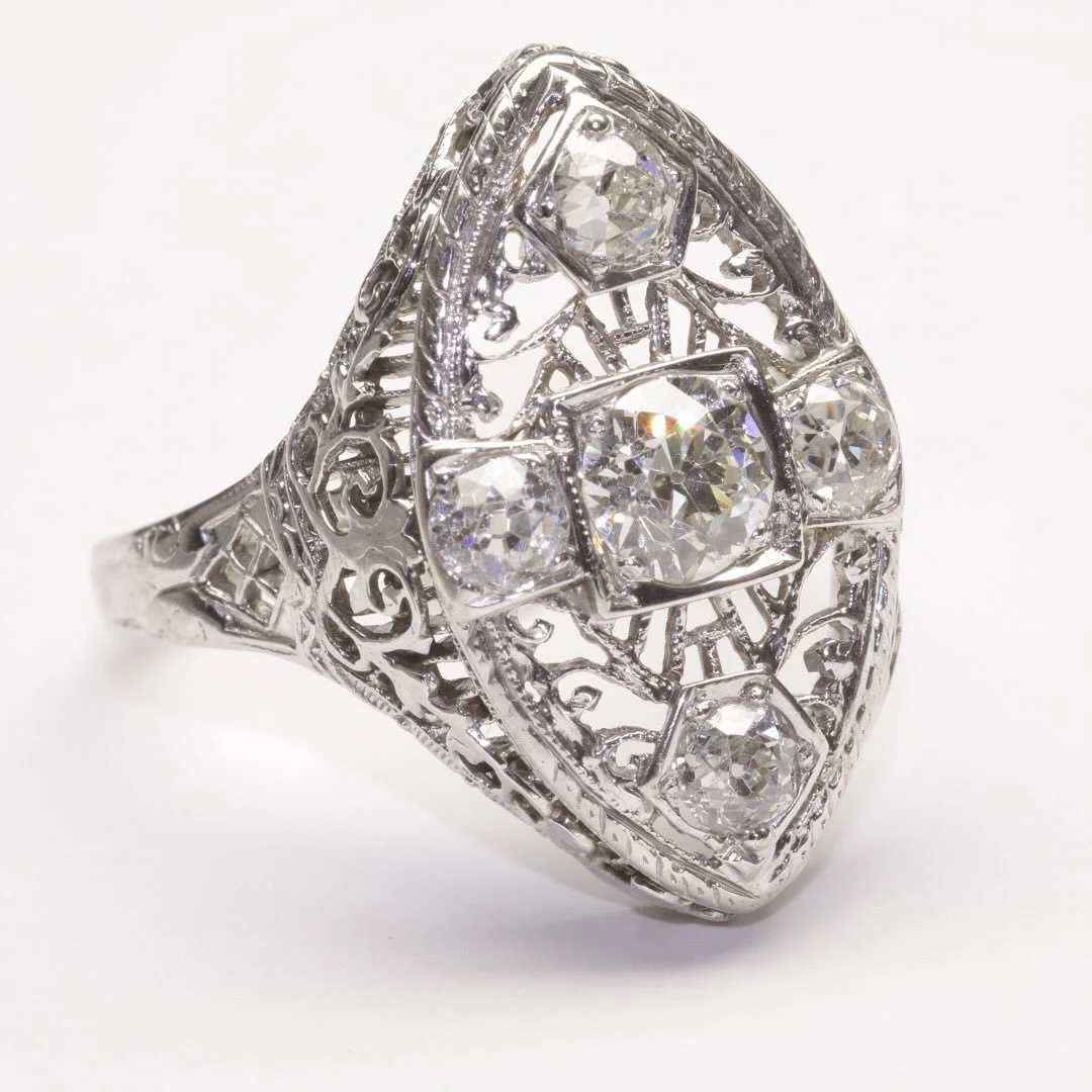 For a birthday, wedding anniversary, or any other occasion, this vintage Art Deco 18-karat white gold ring will lift your everyday into elegance. With approximately 1.00 carat total weight in old European cut diamonds. #artdecorings #vintagediamondri